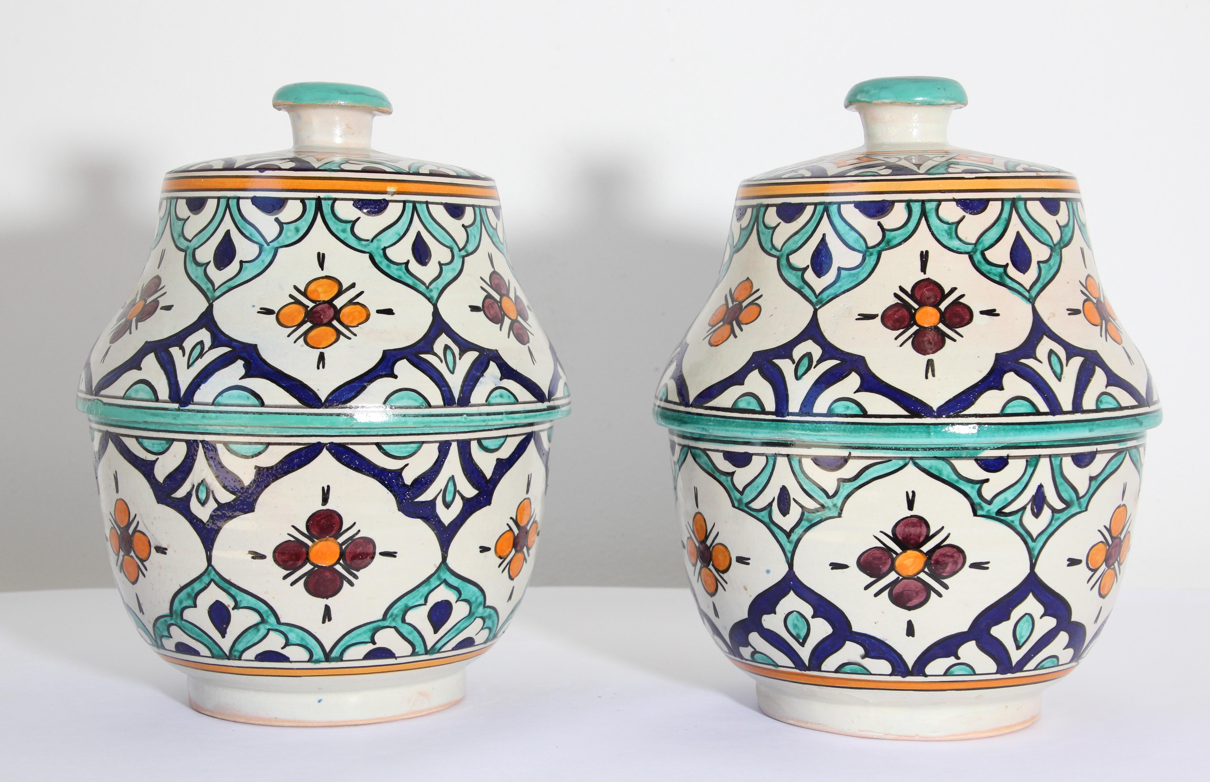 Large pair of Moorish Moroccan glazed polychrome ceramic jars tureen with cover.
Hand painted ceramic Jubbana, handcrafted by skilled Moroccan artisans in Fez Morocco.
Moorish designs in turquoise, cobalt blue, teal, saffron yellow, prune and