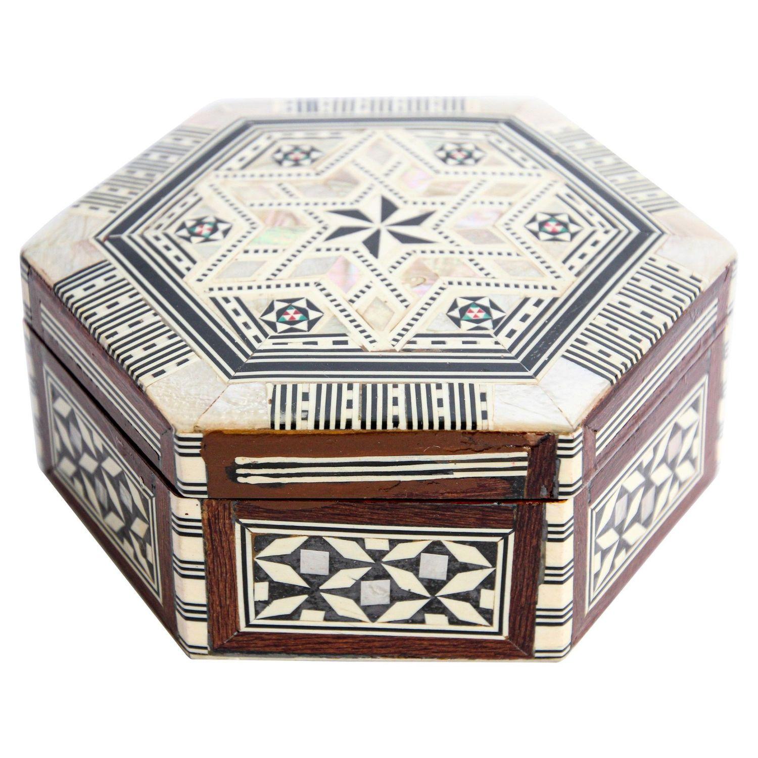 Exquisite handcrafted Middle Eastern Lebanese mosaic inlaid walnut wood box. Small hexagonal walnut box intricately decorated with Moorish motif designs which have been painstakingly inlaid with mosaic marquetry. The interior is lined with red