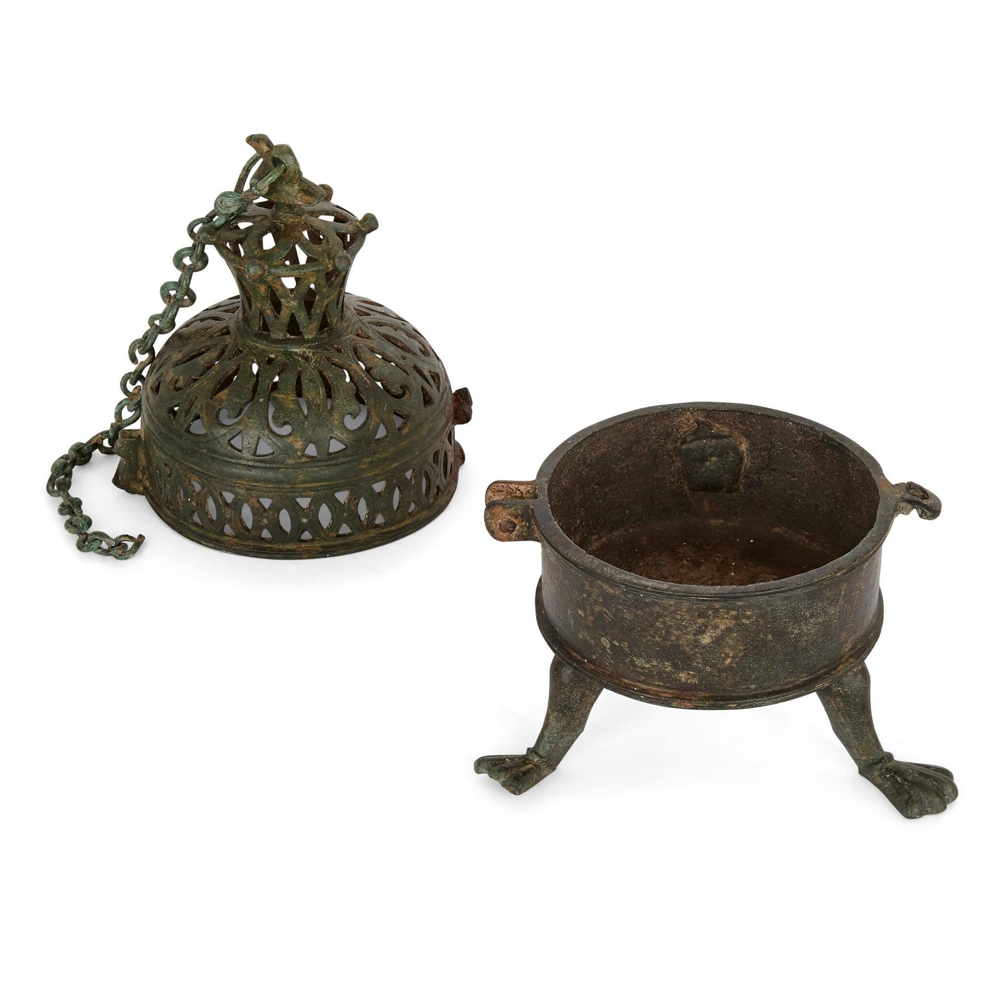 Moorish incense burner from Spain, dated to 10th-12th century
Spanish, 10th-12th century
Measures: Burner height 20cm, width 12cm, depth 12cm
Box height 23cm, width 21cm, depth 18cm

This rare object is a bronze incense burner. The burner was