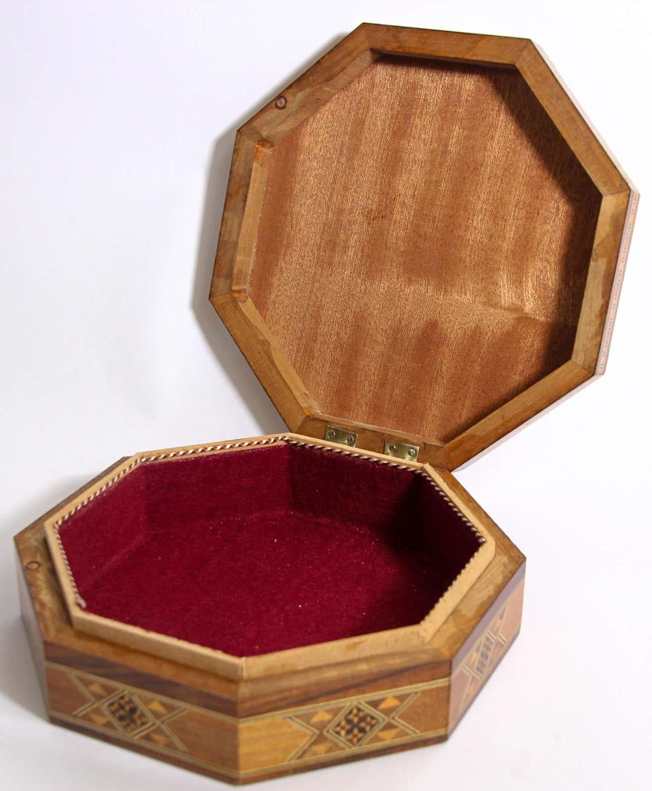 Large Moorish inlaid marquetry mosaic octagonal jewelry box.
The amazing craftsmanship in intricate marquetry fruitwood with mosaic Moorish geometric pattern mosaic inlay makes it a true work of art.
Handcrafted in the Middle Easter Moorish Syrian