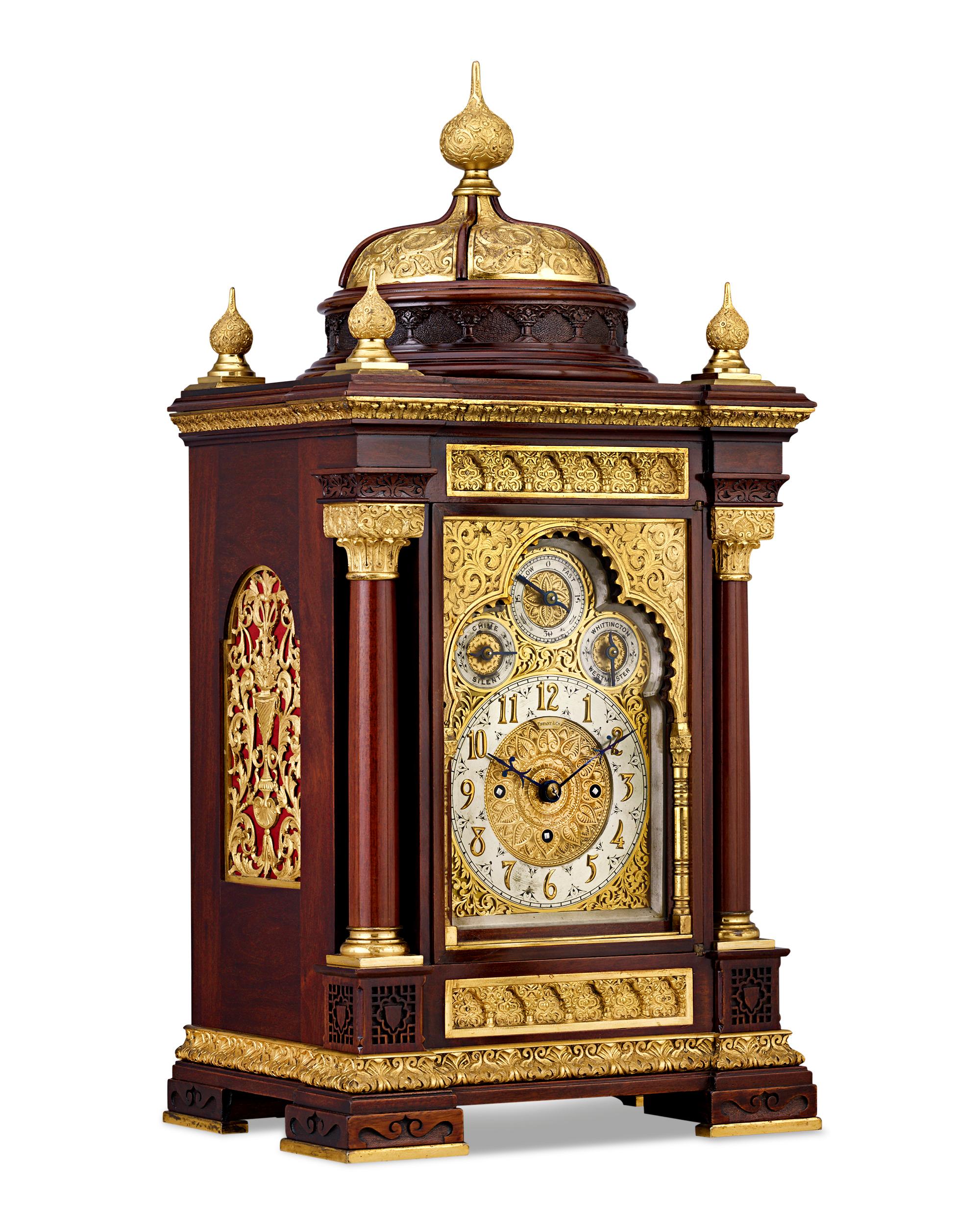 An incredible example of American clockmaking, this Tiffany & Co. mahogany and gilt bronze mantel clock is a shining example of the firm's outstanding artistry in decorative metalwork. The timepiece is embellished with chased designs in a Moorish