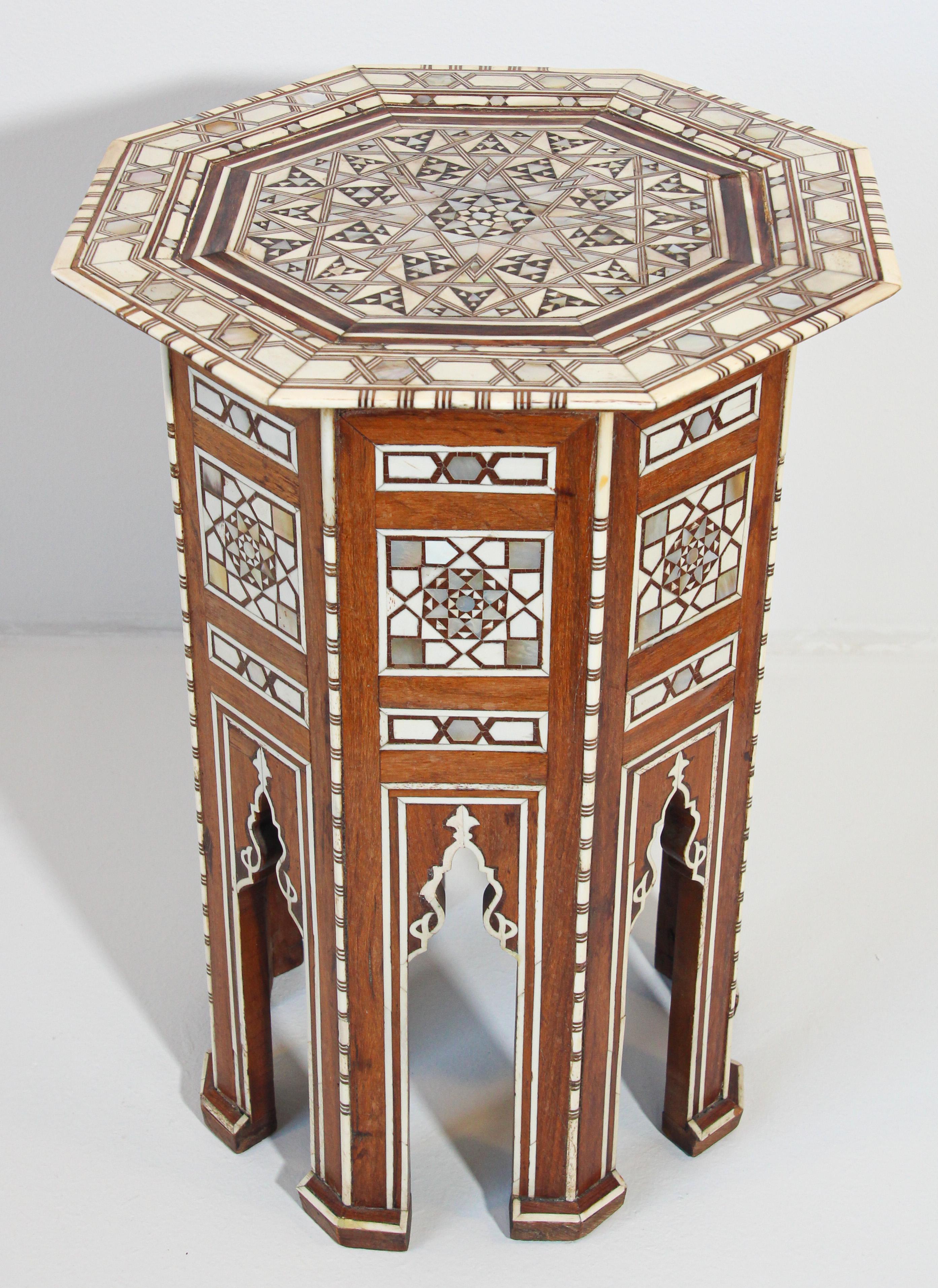 Gorgeous, Moorish style, one of kind 19th century antique Middle Eastern Egyptian, Syrian or Lebanese octagonal pedestal table inlaid with bone and precious fruitwood.
Elegant fine antique Moorish side table with intricate mosaic marquetry work in