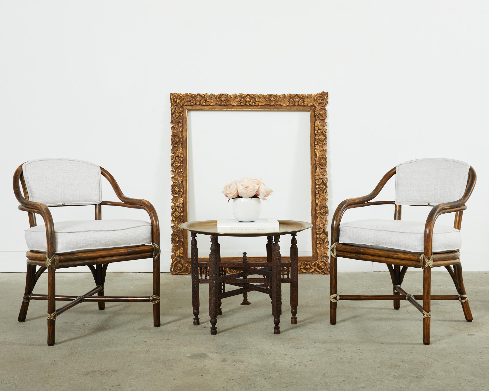 Large six leg brass top drink table or coffee table made in the Moorish Moroccan taste. The table features a six leg folding base with carved arabesque designs and turned finials. The folding base is topped with a patinated brass tray with
