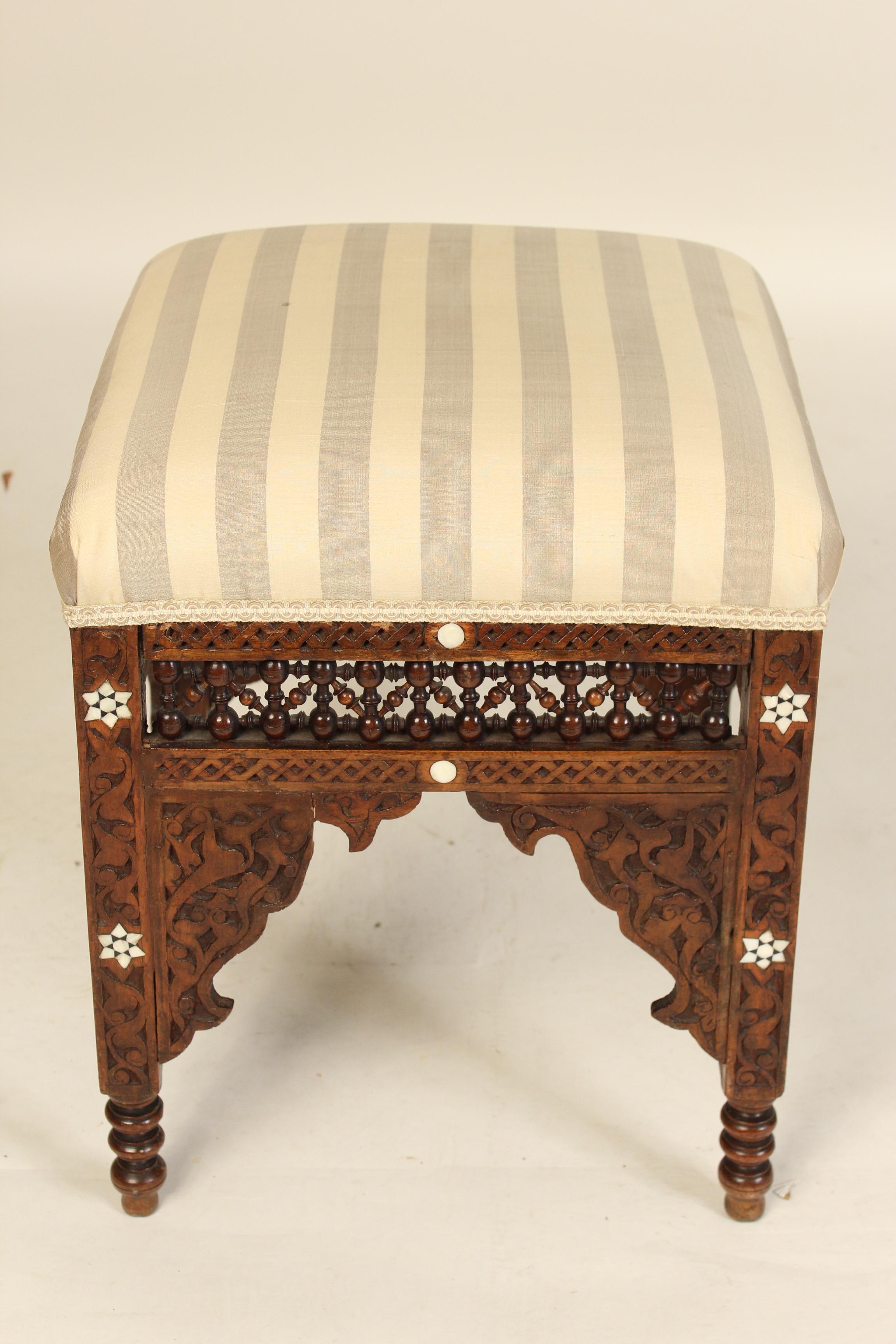Moorish mother of pearl inlaid bench with turned and carved decorations, circa 1920s.
