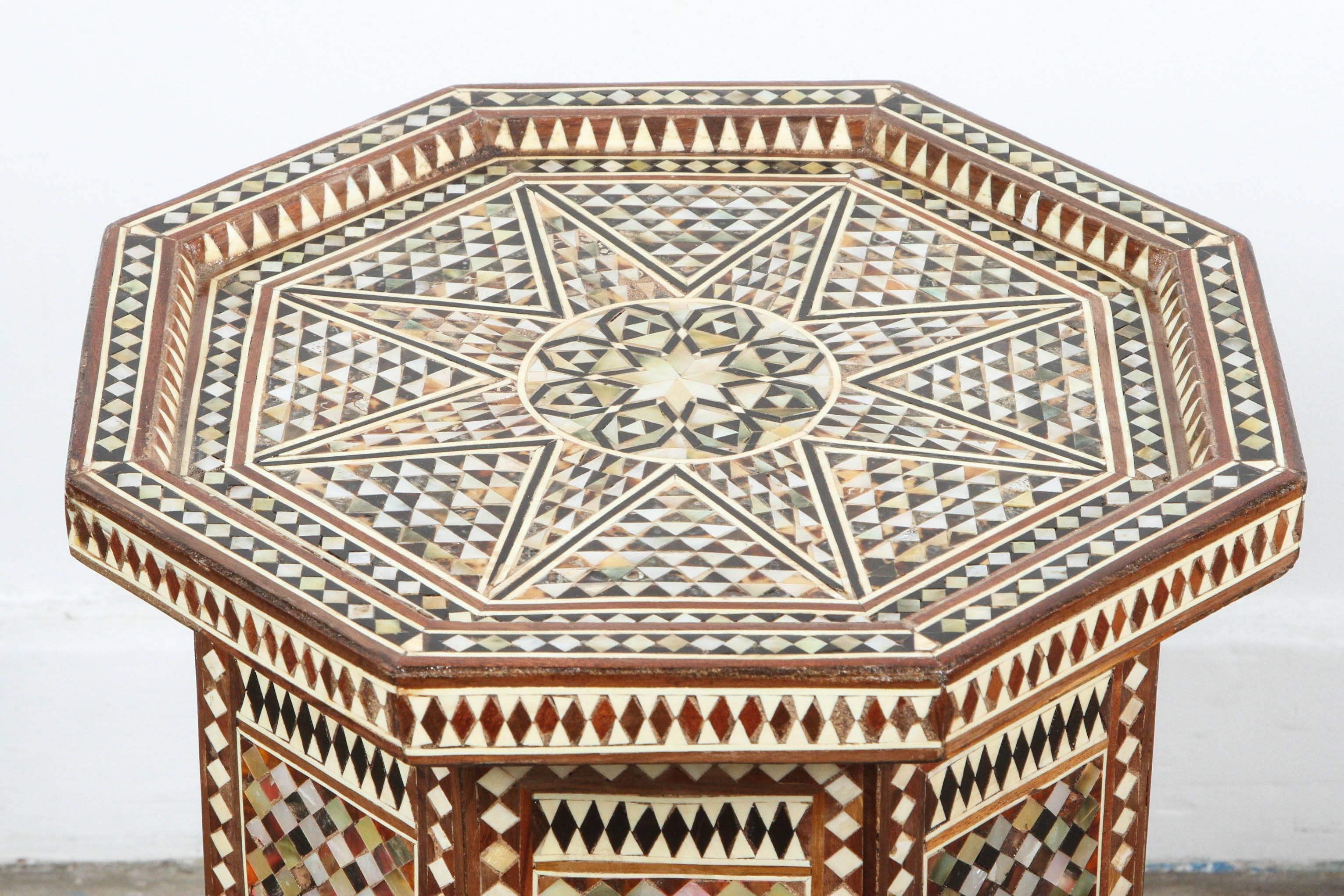 Moorish octagonal walnut side table inlaid with mother of pearl, horn, ebony and camel bone.
Moorish arches on the eight sides,
Great addition for a Moroccan room project.
Very intricate inlay Middle Eastern Moorish ottoman artwork.