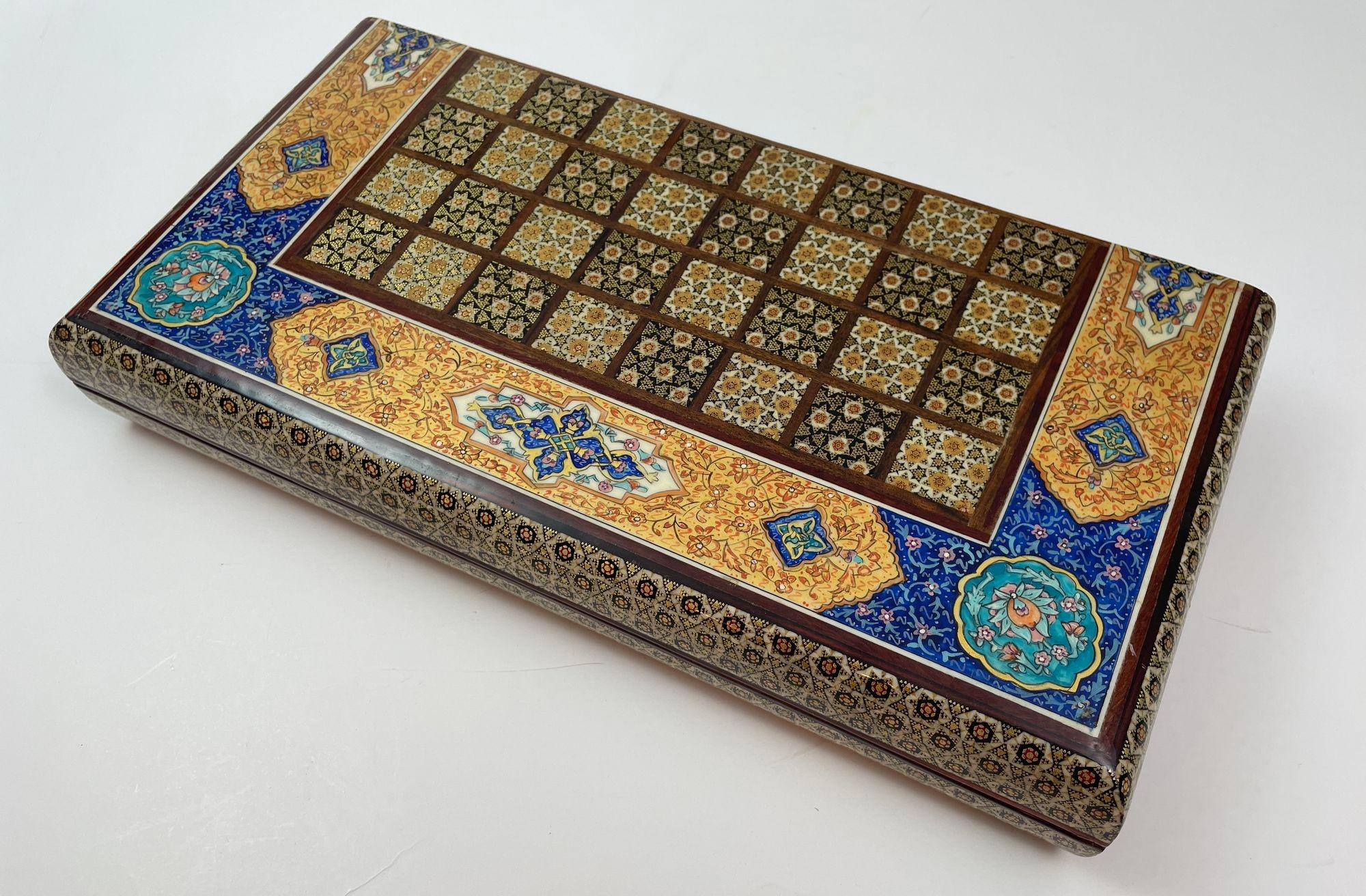 Moroccan Moorish Persian Inlaid Micro Mosaic Backgammon and Chess Board.
Intricately inlaid handcrafted Moorish Persian backgammon and chess checker game box.
Handcrafted beautiful Middle Eastern Khatam wooden box covered with very delicate micro