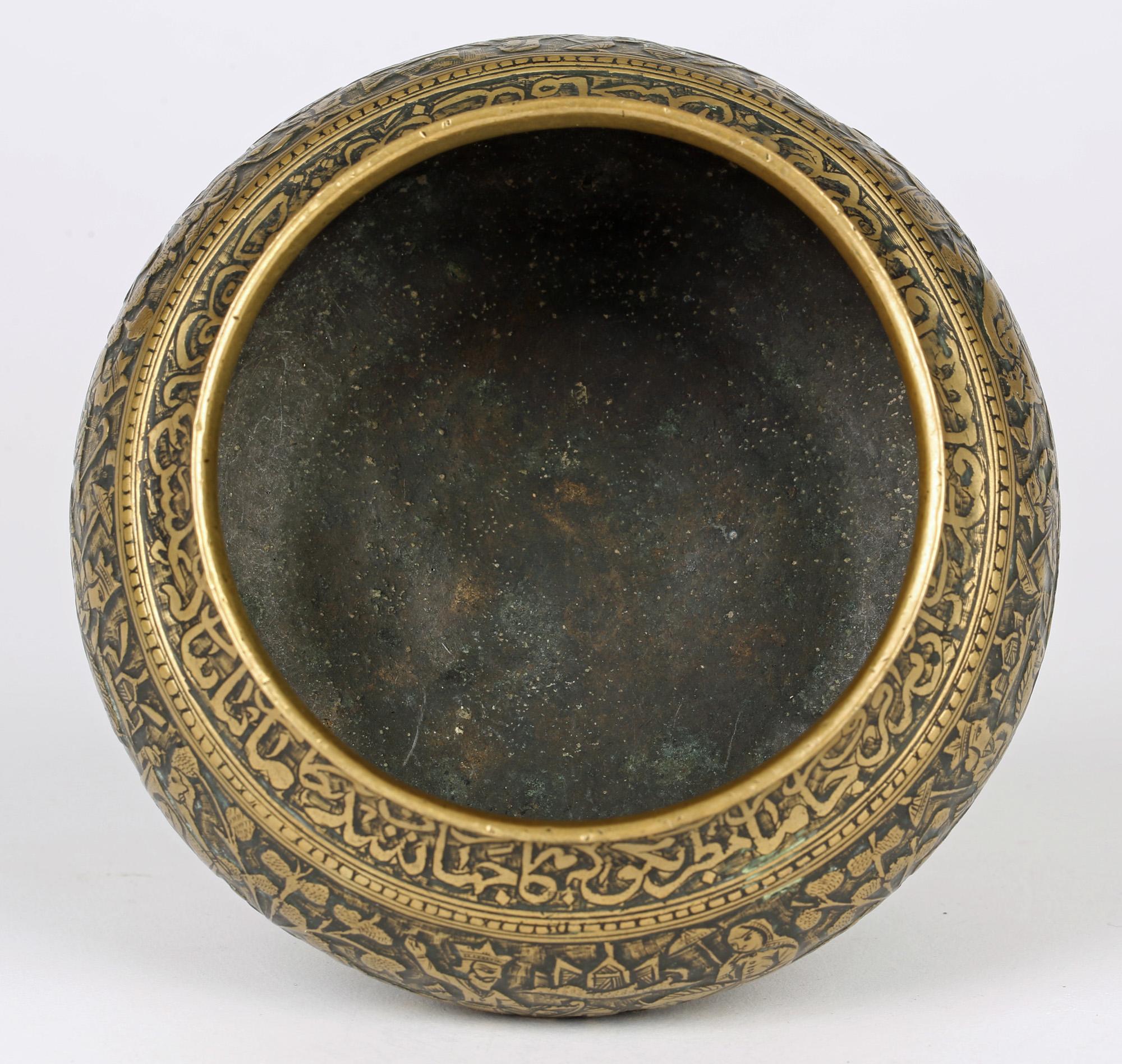 An exceptional hand crafted antique Moorish revival brass bowl engraved in relief with a continuous figural scene, probably a wedding dating from the 19th century. This Middle Eastern rounded bowl is heavily made with a very finely detailed scene
