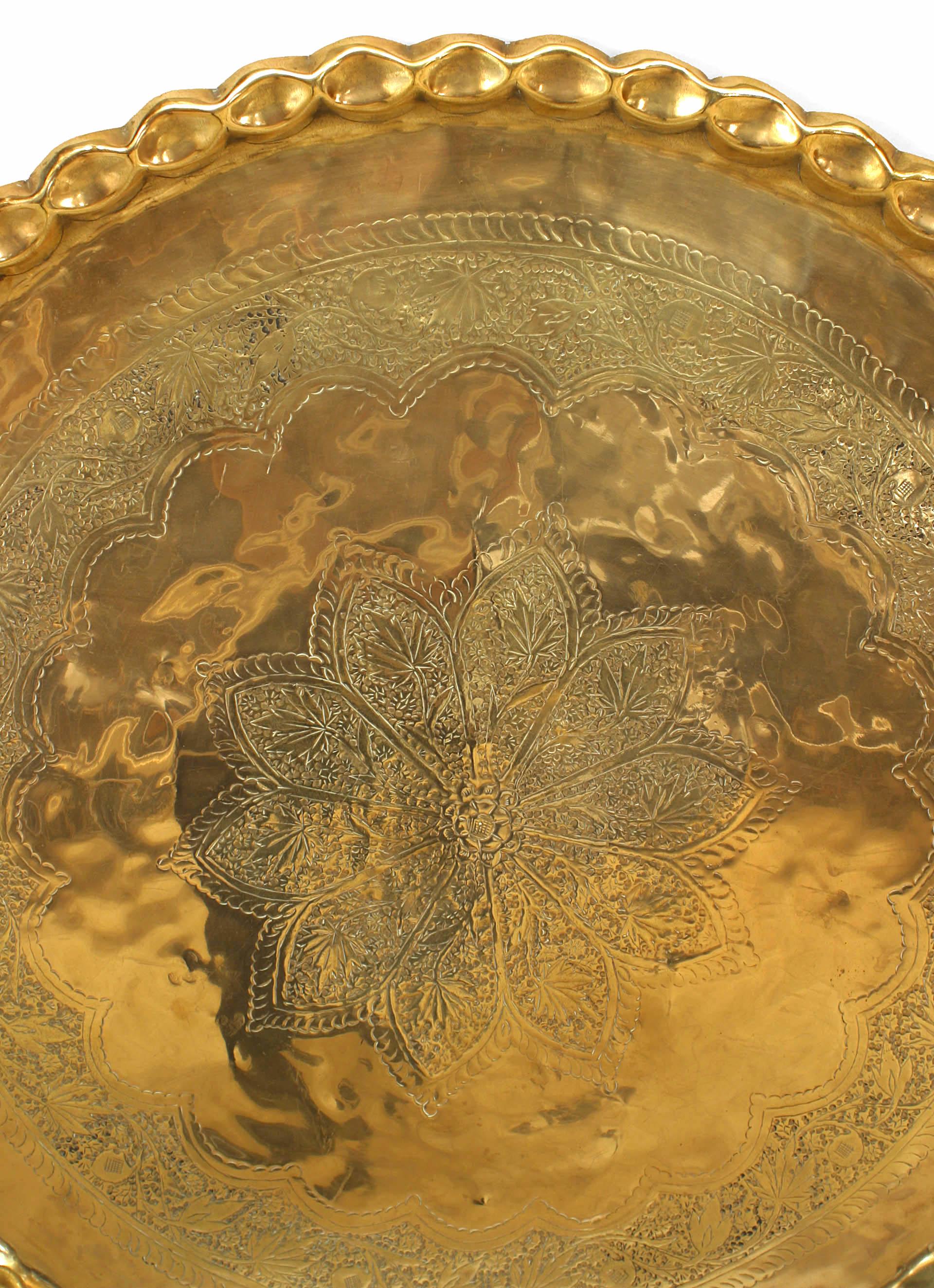 Moorish (19/20th Century) round brass tray with scalloped edge.