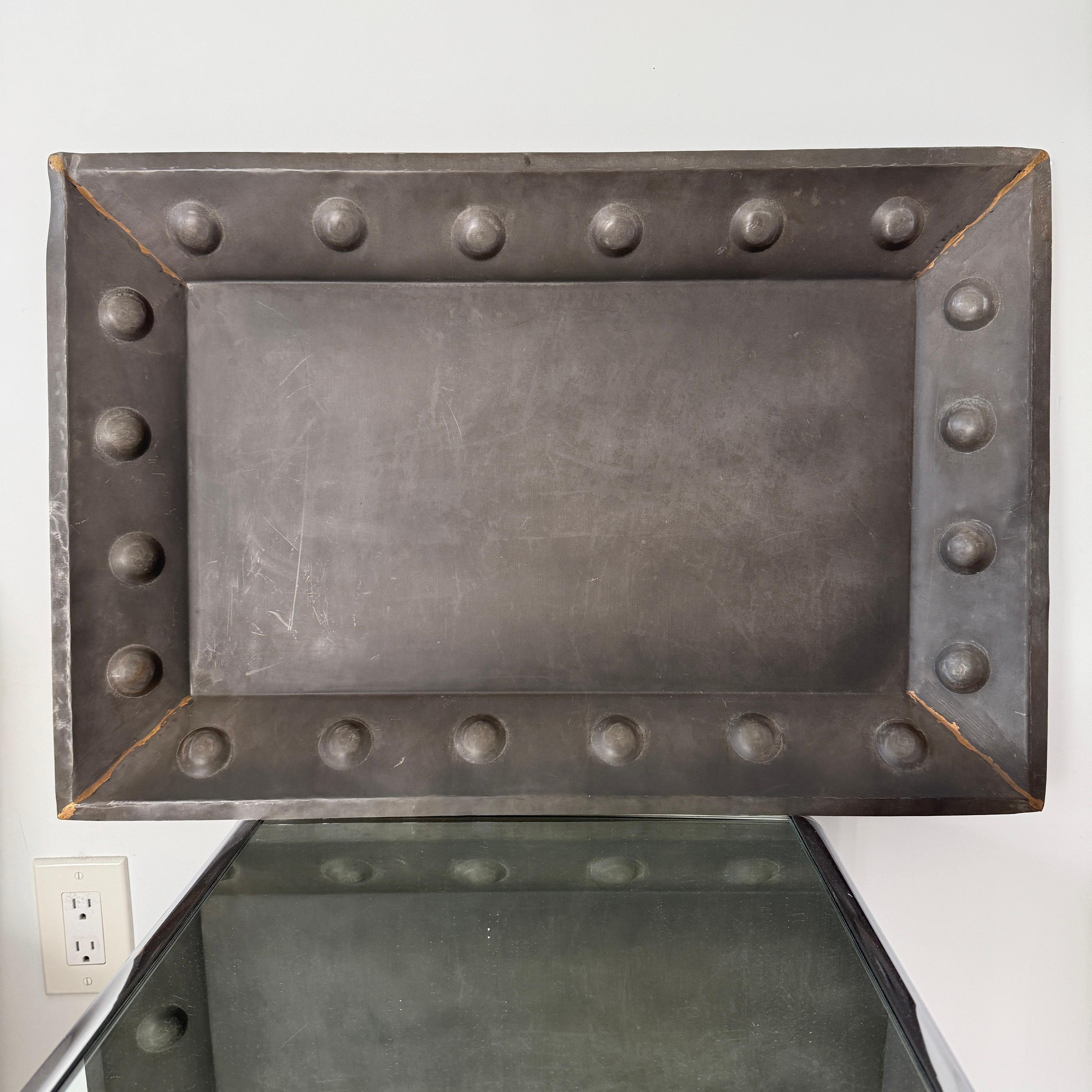 Moorish style handmade iron tray with reverse hammered circles. The large rectangular tray has a natural iron finish with brass weld marks at the corners. Perfect scale for use on an ottoman or on table tops.   

