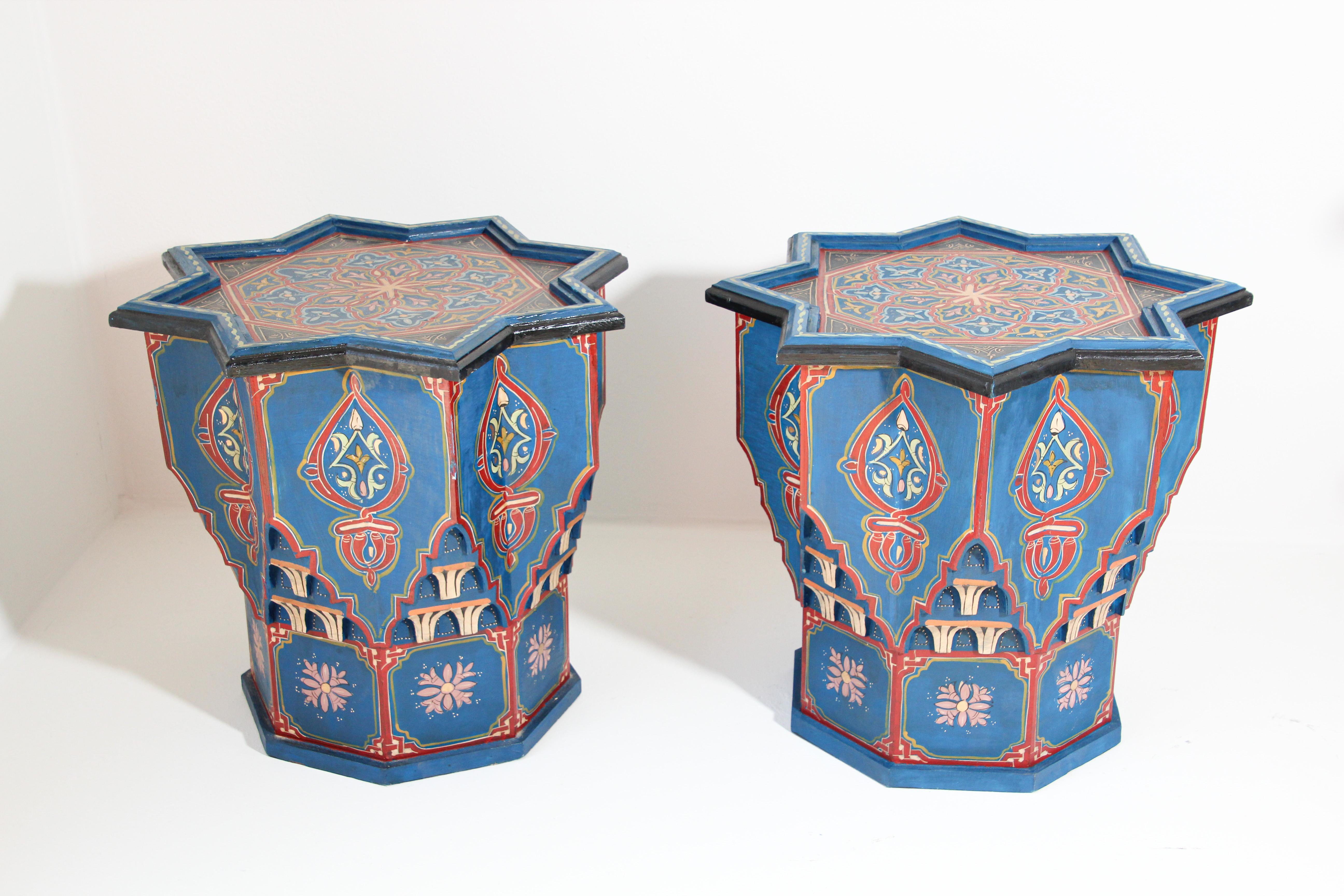 Pair of Moroccan colorful blue hand painted and carved side occasional table with Moorish Islamic designs.
Vintage Moroccan side tables in royal blue background with multicolored floral and geometric designs.
Very decorative fine artwork on a star
