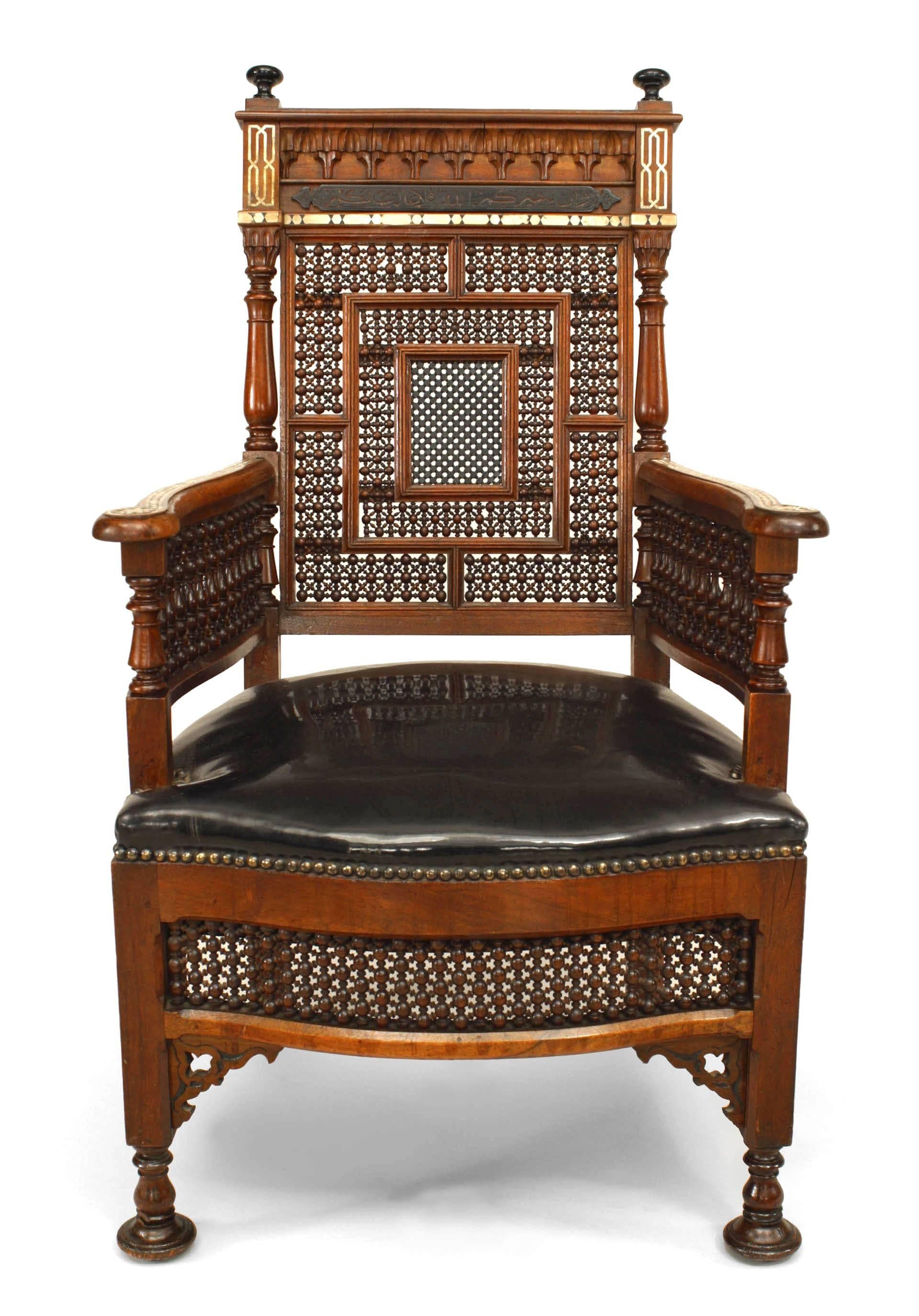 Middle Eastern Moorish style arm chair with carved spindle & ball design back with pearl & inlay and ebonized trim.

