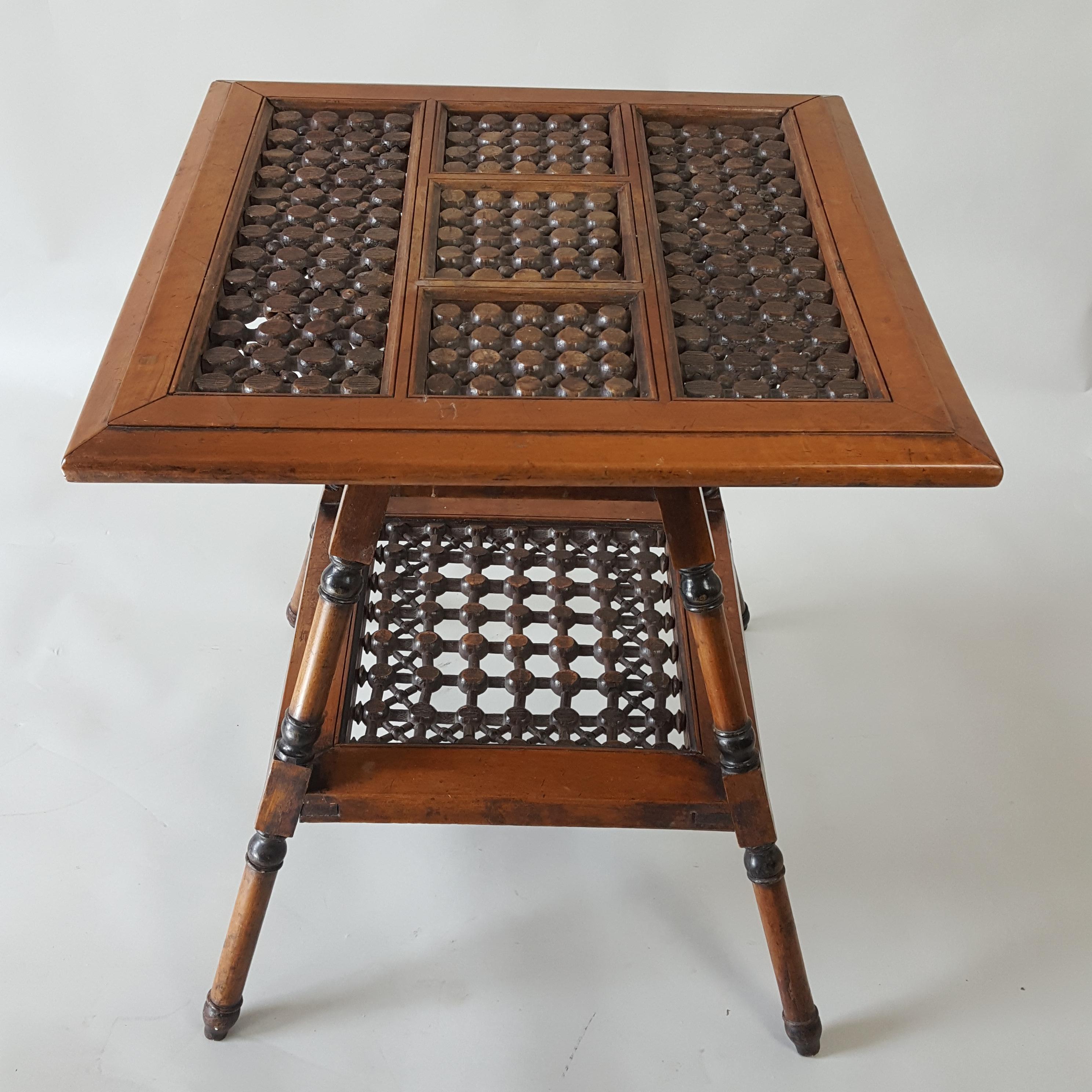 Pretty Moorish style table dating to around 1900 and possibly from Turkey or Syria made for export to Britain where it would have been retailed in fashionable shops of the period eg. Liberty & Co. The table has mashrabiya panels and some ebonised