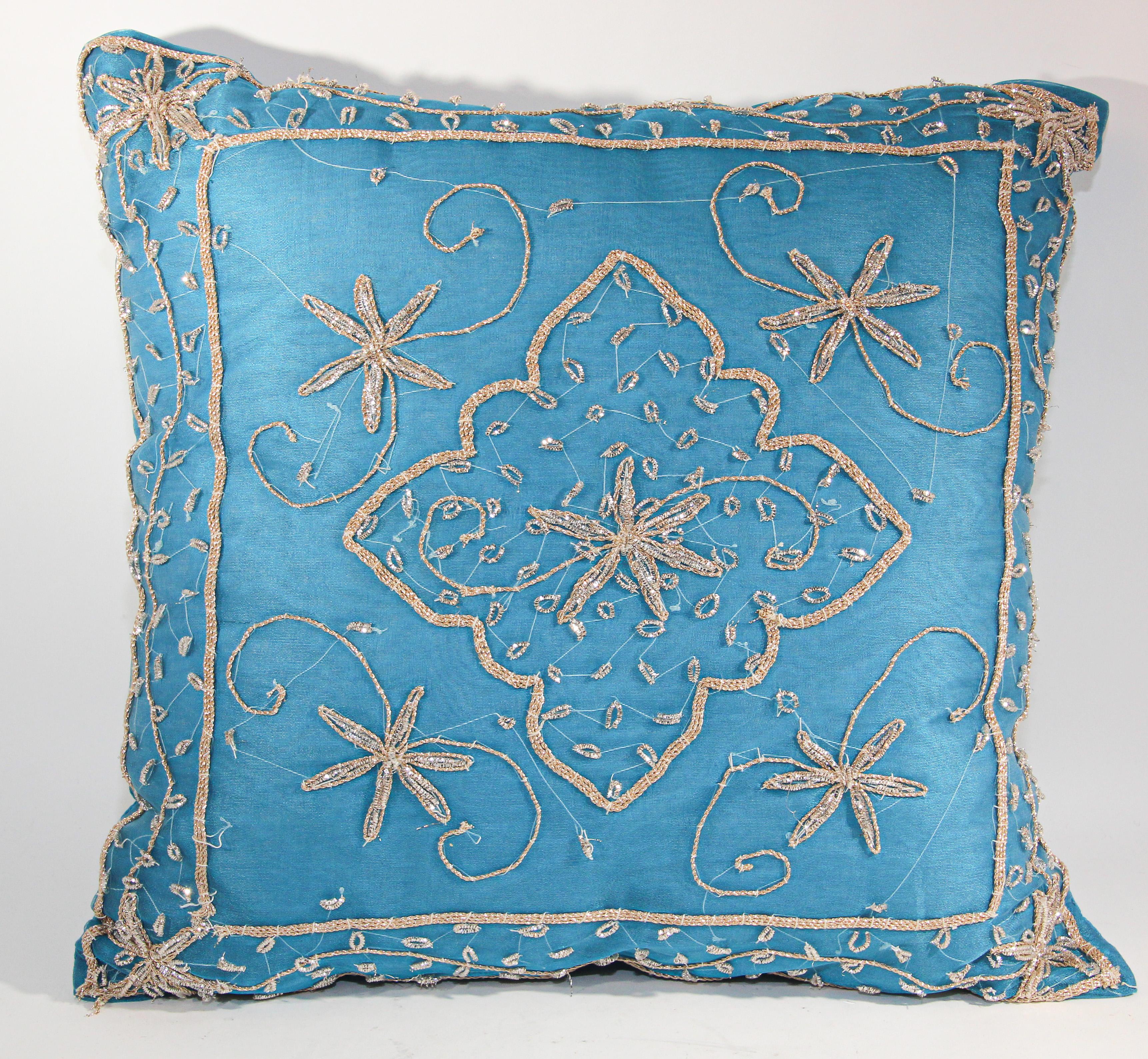 Moorish throw decorative accent pillow turquoise embroidered and embellished with sequins with metallic threads, gold beads embroidery on turquoise.
Heavily embellished border of metallic embroidery Moorish threads, silver beads embroidery on blue