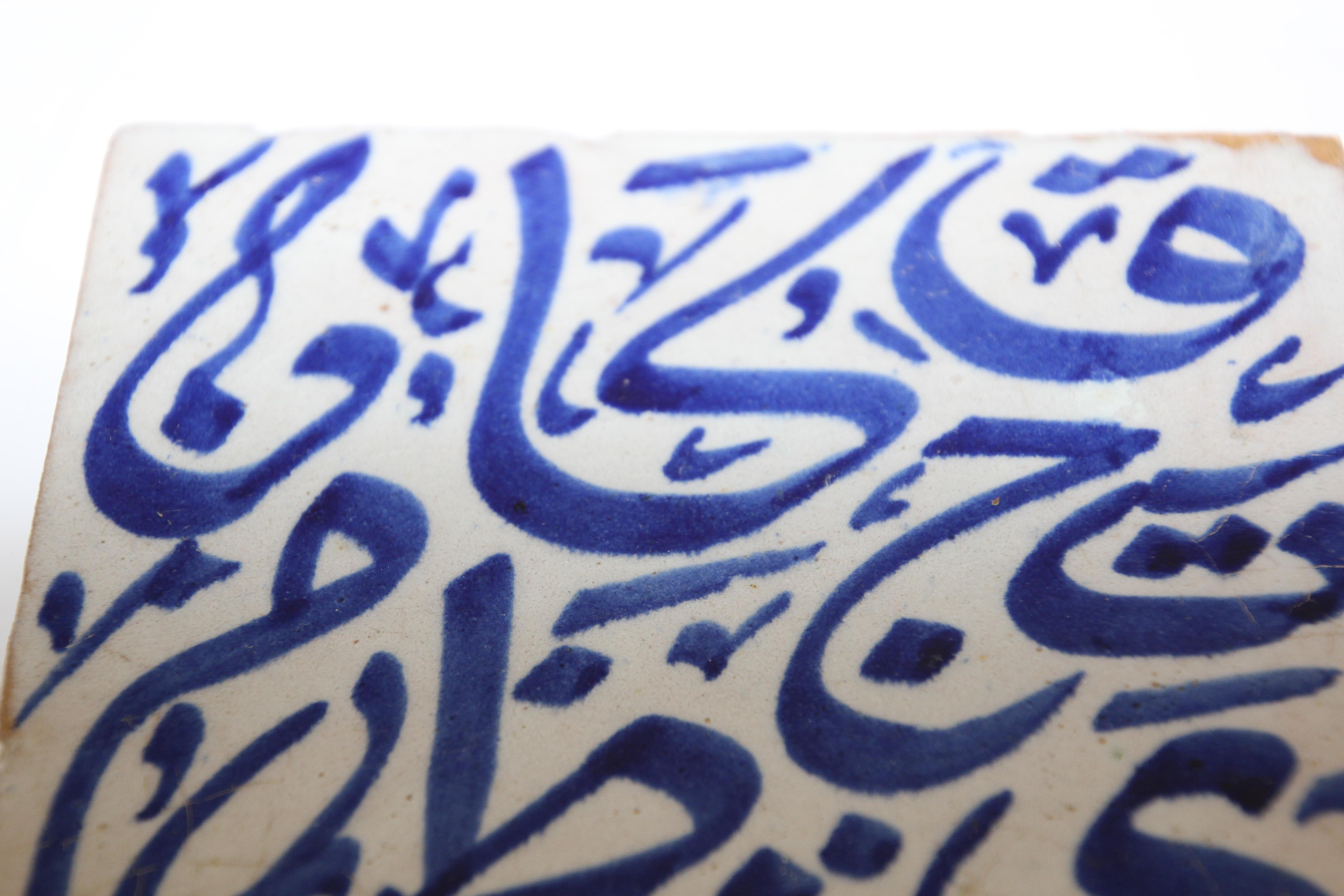 Moroccan handcrafted decorative tile with hand painted Arabic writing in blue crackle glazed ceramic.
Arabic writing on ceramic tile hand painted by artist in Fez Morocco.
Great zellige decorative Moorish Artwork.
Tile is 6 in. x 6 in.