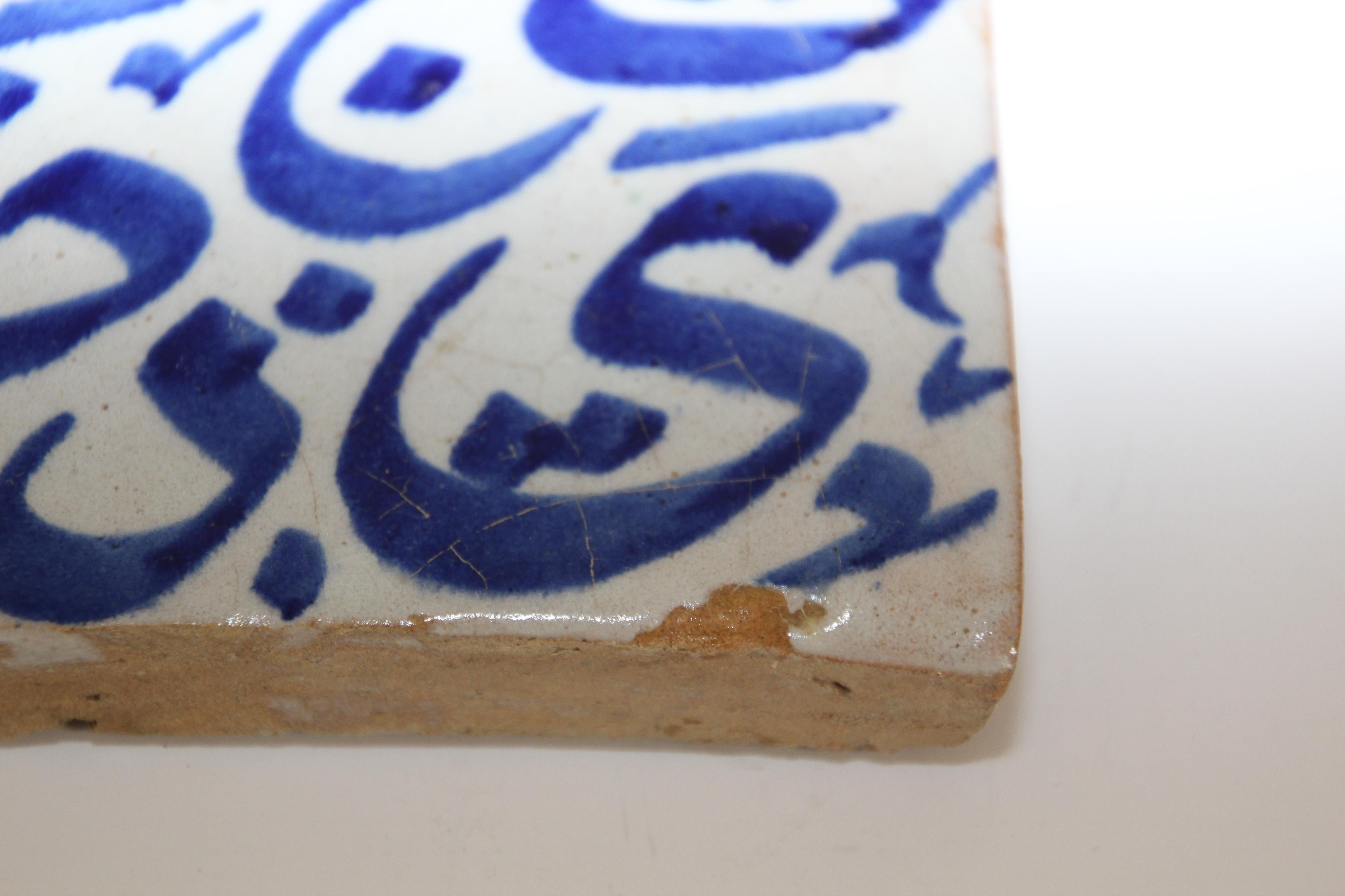 Moroccan Moorish Tile with Blue Arabic Writing