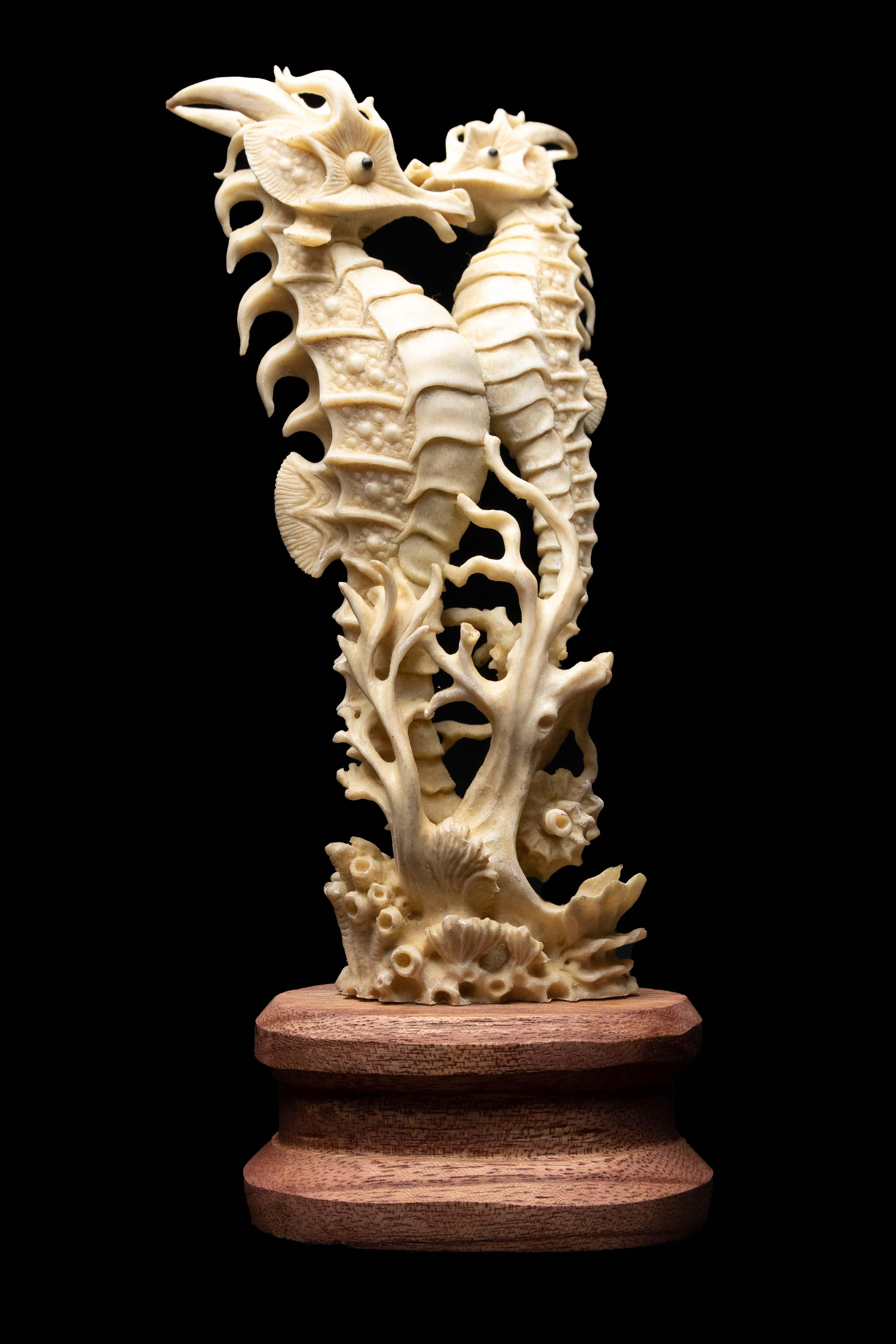 Carved moose antler Seahorse. Detailed moose antler carving of a Seahorse, from Indonesia. This is a one of a kind object. The moose antler was sourced in North America and then sent to Asia for carving. Quality of ivory, but with sustainability, as