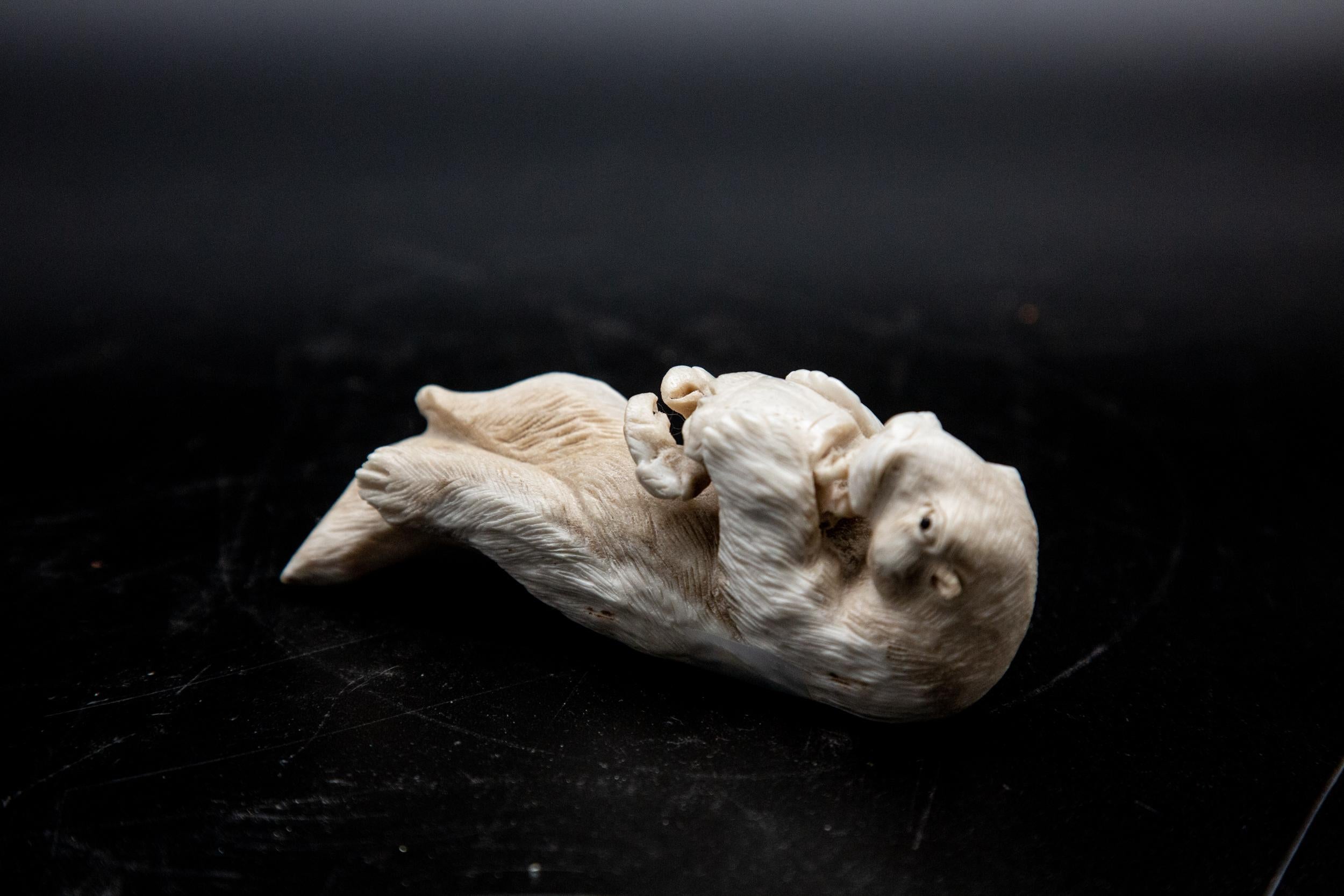 Hand-Carved Moose Antler Otter Eating Crab