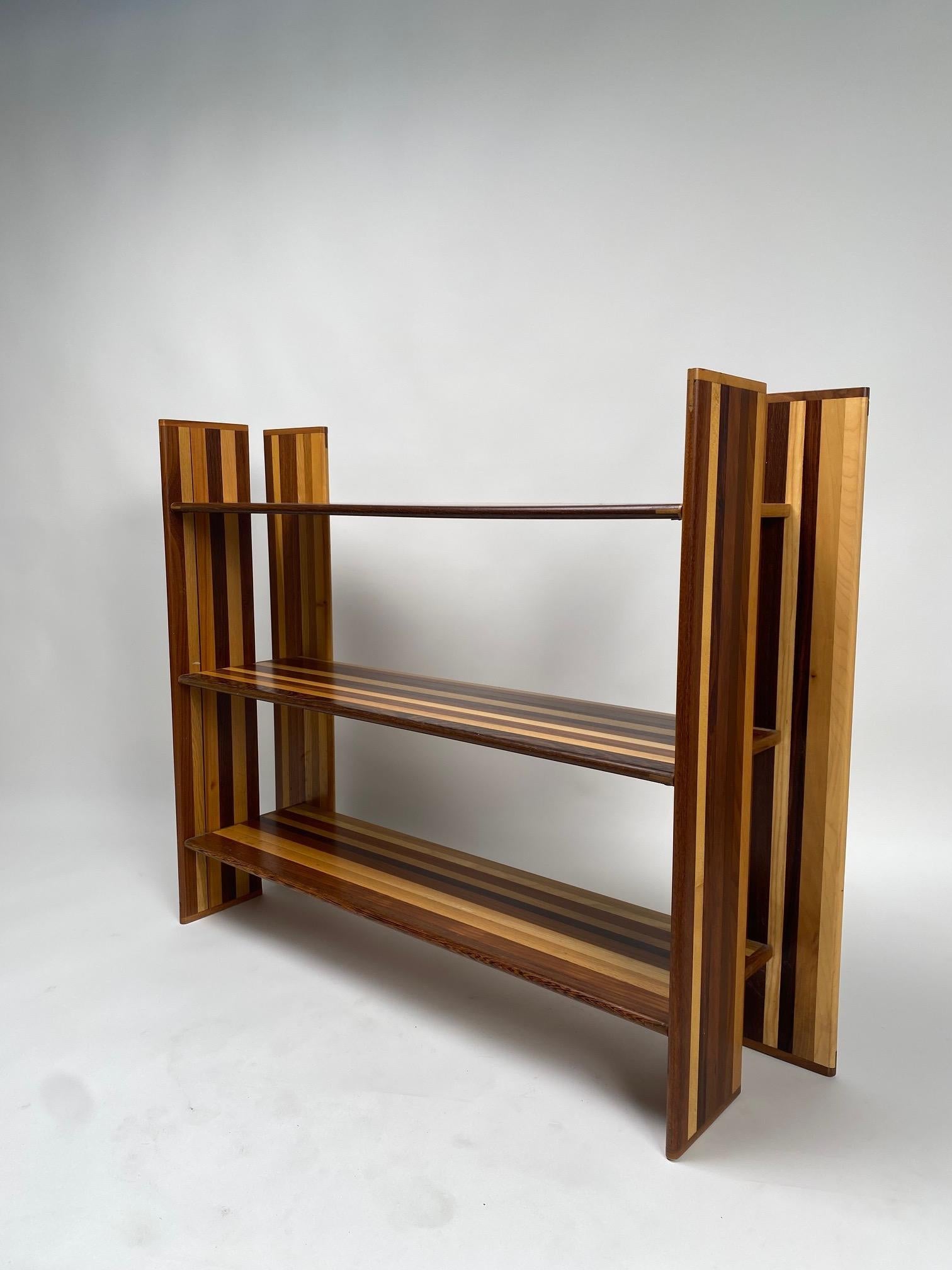 MOP, Divider bookcase made by Afra and Tobia Scarpa for the Molteni company, Italy, 1974

It is one of the most original projects of the famous couple of Italian architects and designers, created by combining wood of different essences and giving