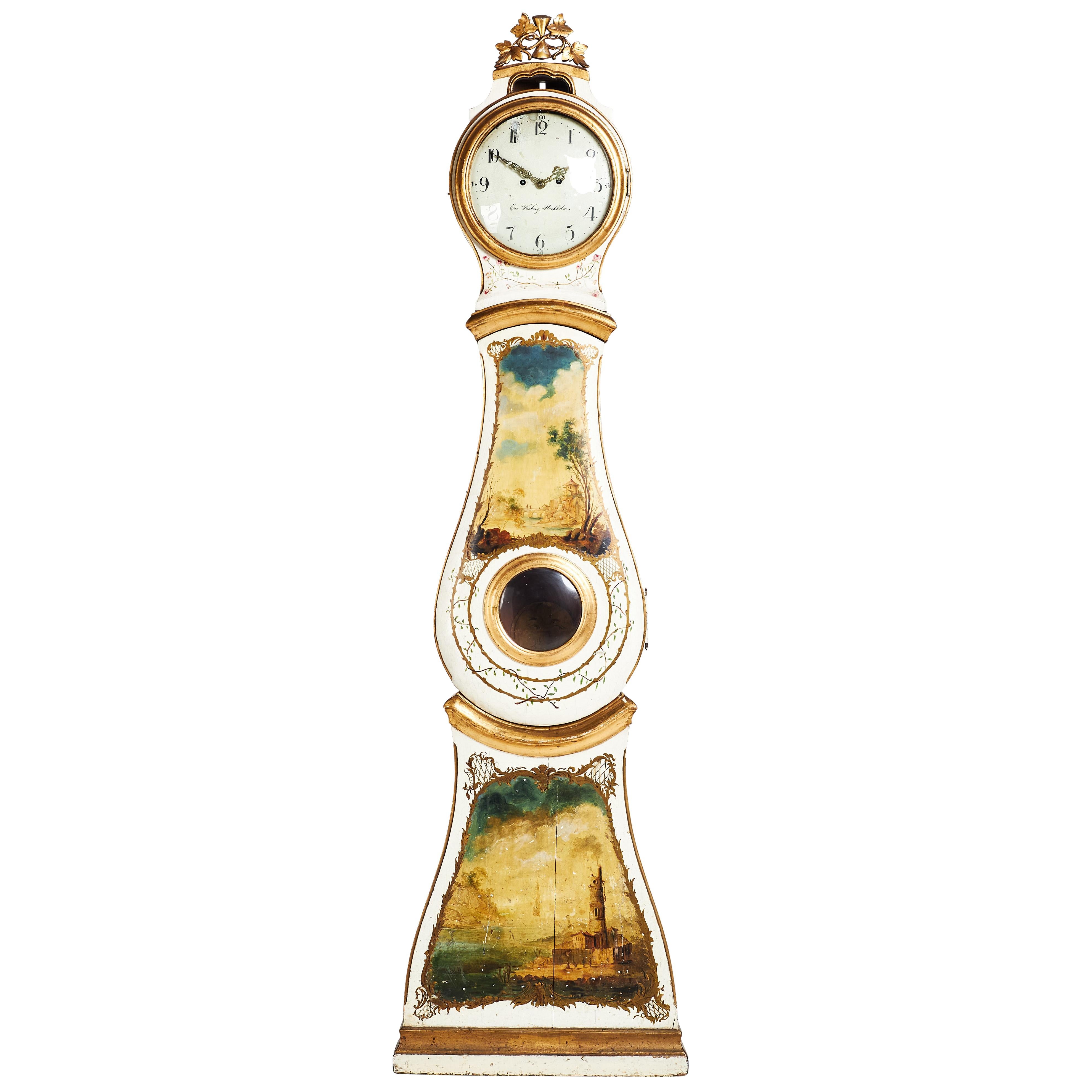 Antique Rococo Mora Clock with original decorative painting details. Case from Stockholm send half of 18th Century, dial inscribed by Eric Wasberg. Original mechanism with weights and pendulum. Gilded decorative details with painted landscape scenes