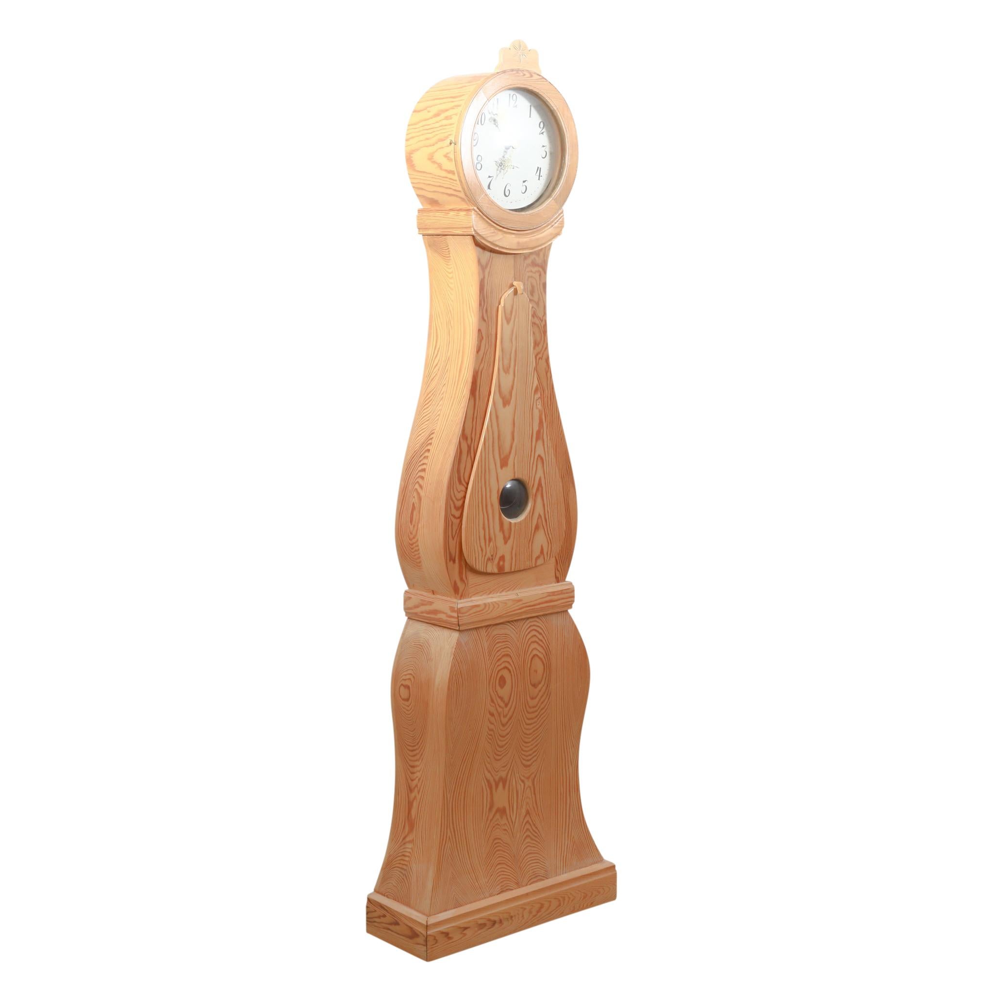 Swedish Mora clock from the 1960's in original wood. Working Longcase clock mechanism of pendulum and 2 weights and a bell chime on the hour.

Width: 56cm / 22.0