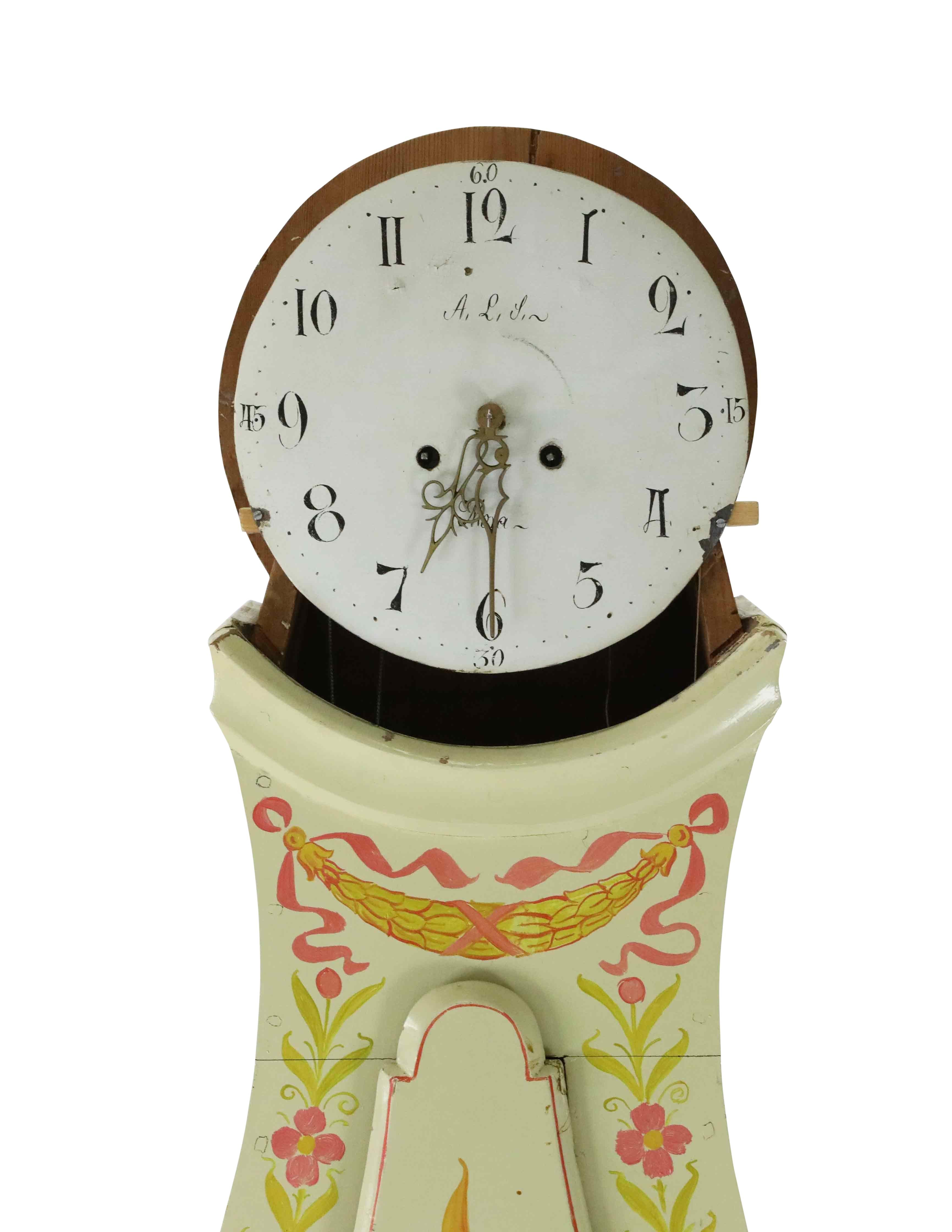 Swedish Mora clock from 1830 in original colour. Cream with hand painted floral detailing.  Longcase clock mechanism of pendulum and 2 weights and a bell chime. This Mora clock contains a hand written original enscription dated 1902 from the second