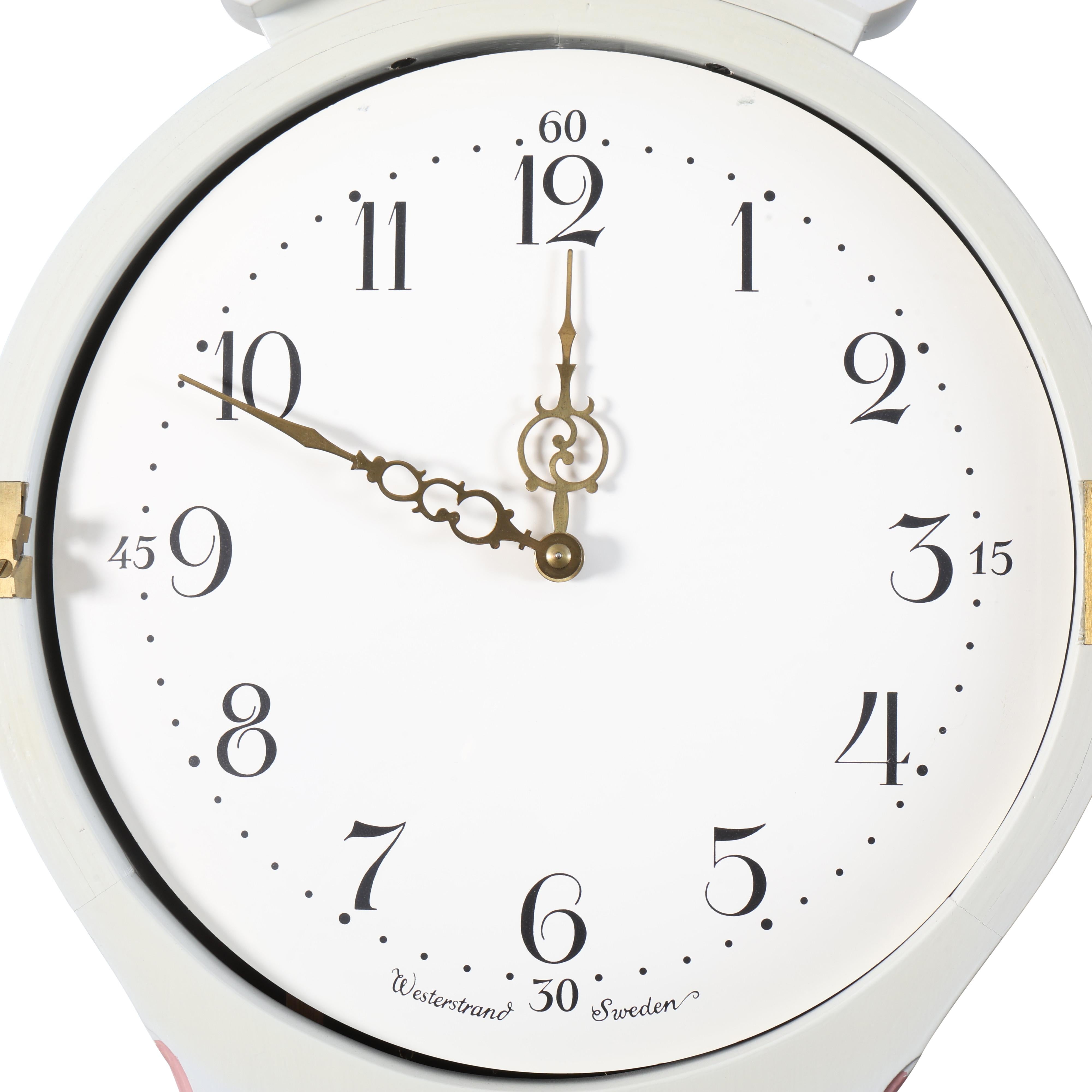 Swedish Mora clock from the 1960's in original colour. Off white with pink highlighting. Working Longcase clock mechanism of pendulum and 2 weights and a bell chime on the hour.

Width: 55cm / 21.7