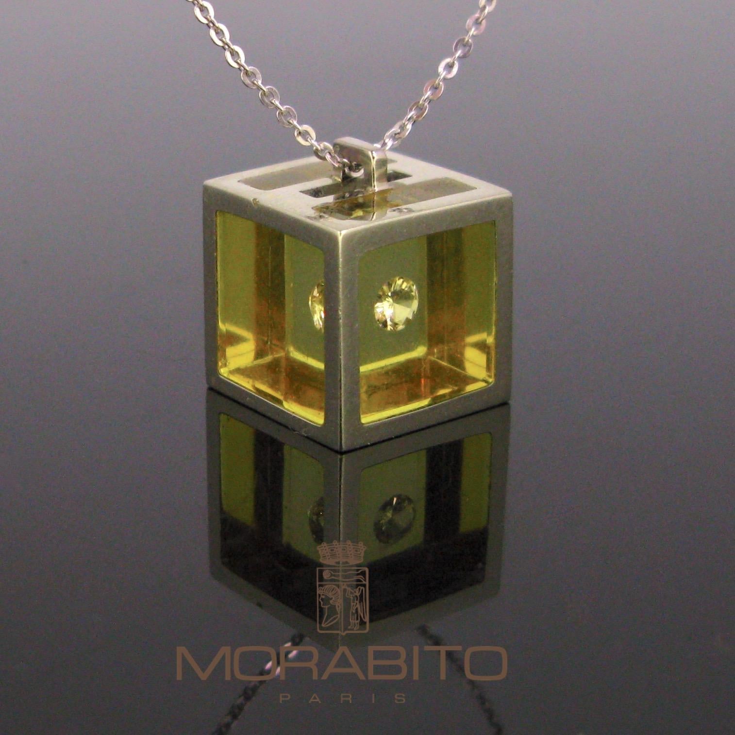  A unique piece made by the French jeweller Pascal MORABITO. In 1972 he created a cube made in synthetic crystal with golden edge with a trapped diamond inside. The cube was name the Captive Diamond. Its creation is now exhibited in New York in the