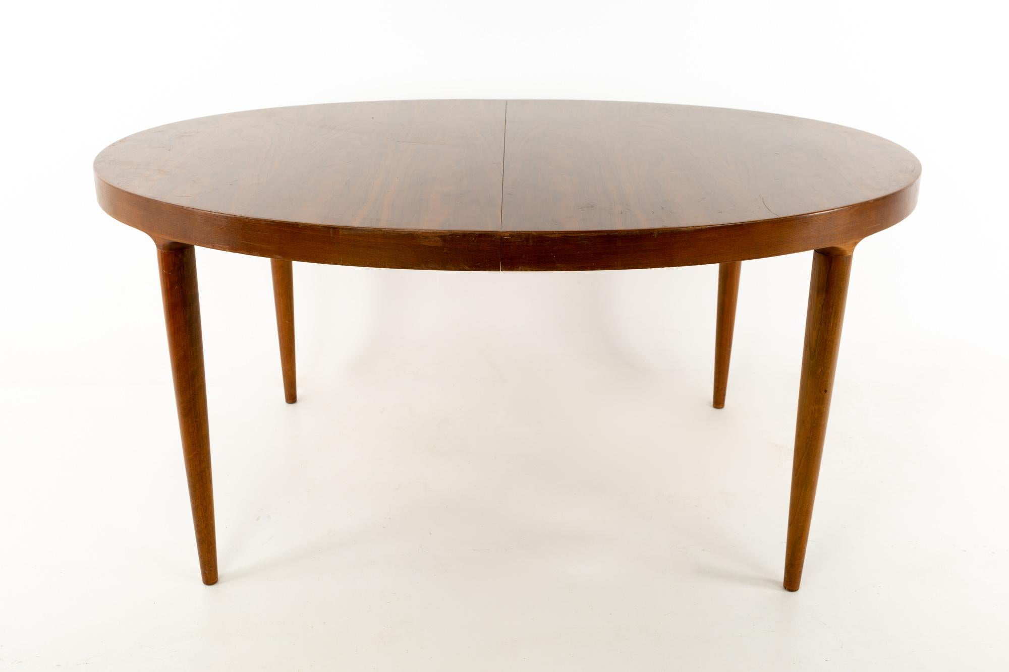 Moreddi midcentury Danish modern walnut oval dining table
This table is 59 wide x 43 deep x 28.5 inches high and each of the two leaves is 19.5 inches; for a total table width of 98 inches

Each piece of furniture is available in what we call