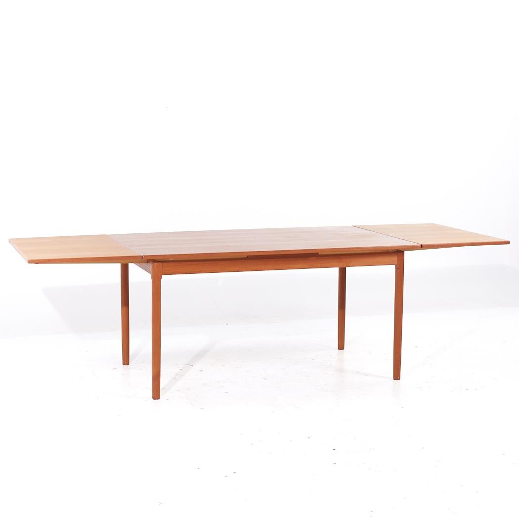 Teck Moreddi Style Mid Century Danish Teak Hidden Leaf Expanding Dining Table (Table de salle à manger à feuilles cachées) en vente