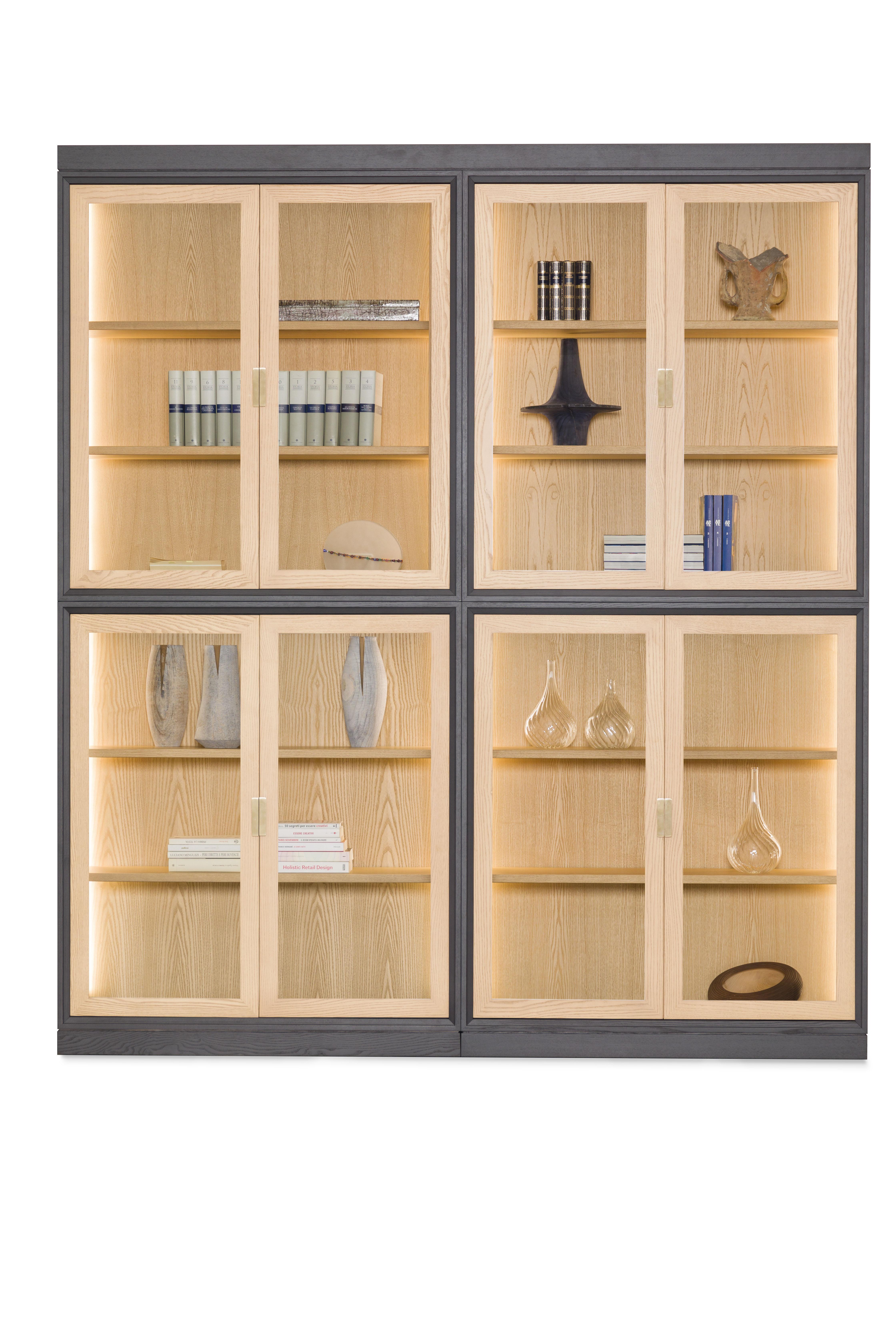Novecento is a Contemporary style bookcase with doors and adjustable shelves.
Inside the modules a warm led light highlights the objects they contain.

The structure is made of ash wood, handles are brass

Made in Italy by Morelato.

Made to
