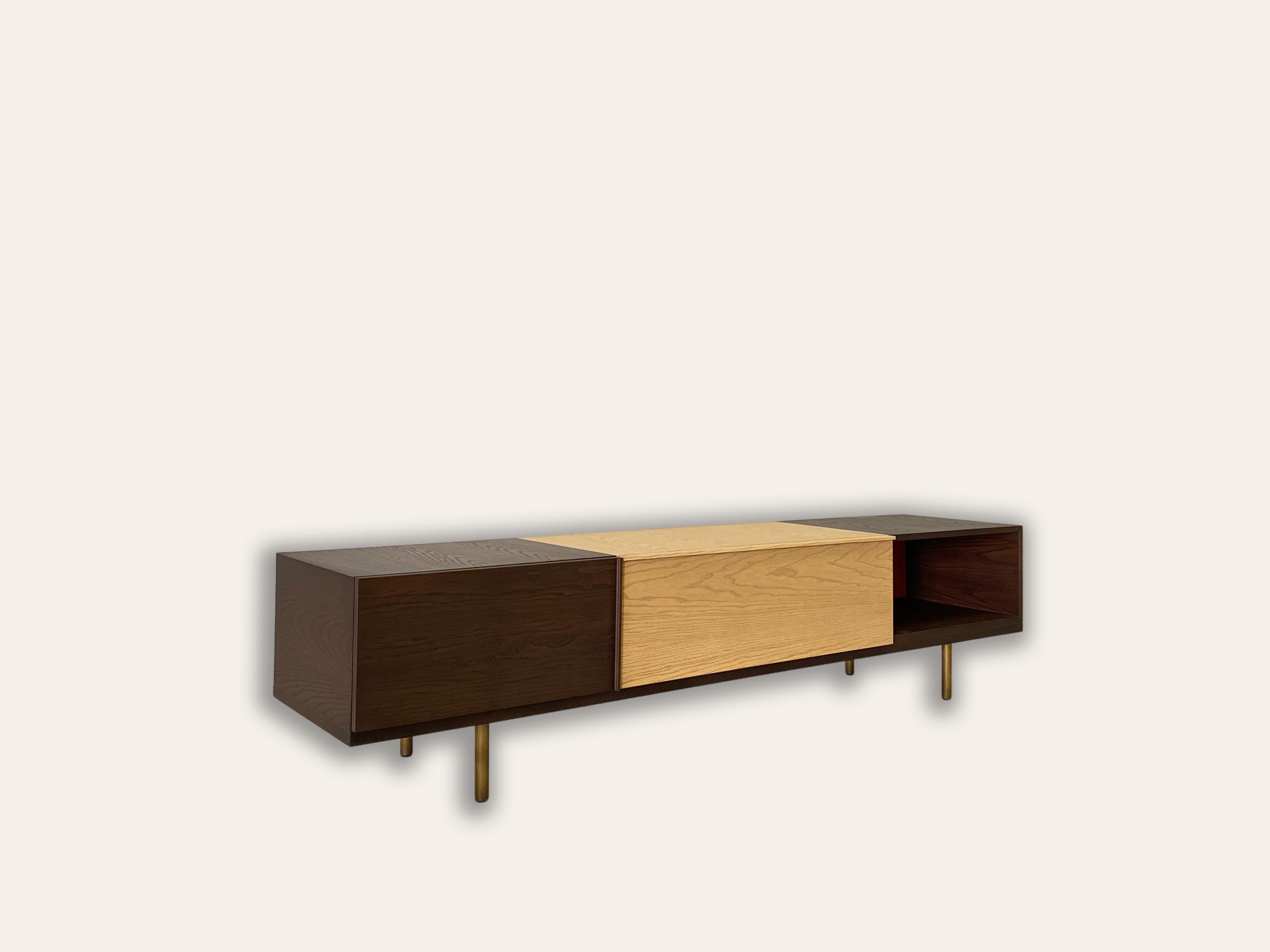 Morelato presents a new modular system with standing or hanging elements of different sizes, suitable to furnish many different spaces. Each element can be open, or with doors or drawers. The structure is made of ashwood in different color stains to