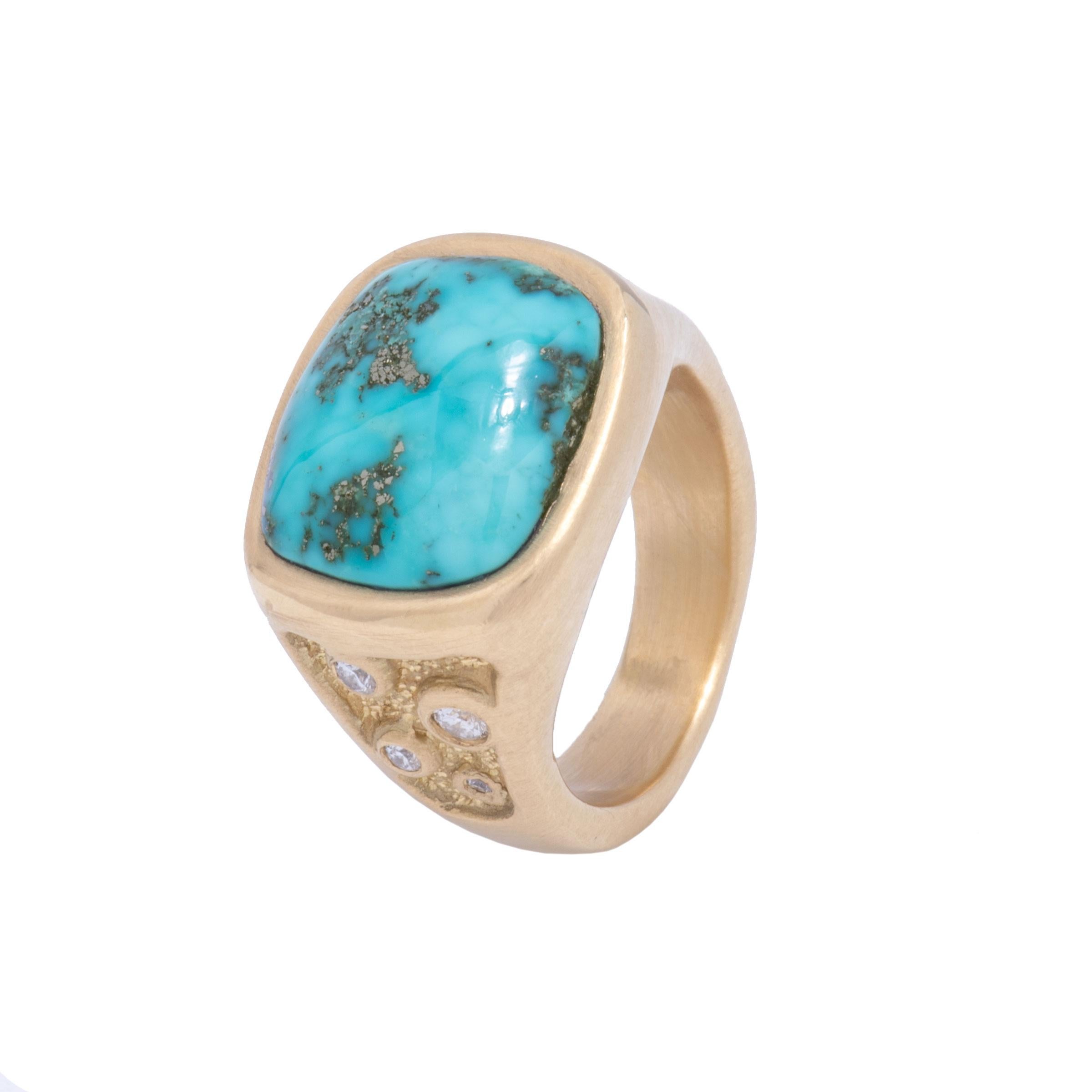 The Morenci Turquoise in this 18 karat signet ring is a magnificent cabochon in deep sky blue with a silvery matrix like an ocean archipelago. A tapering shank is studded with a galaxy of white diamonds .20 tcw and is both textured and smooth. The