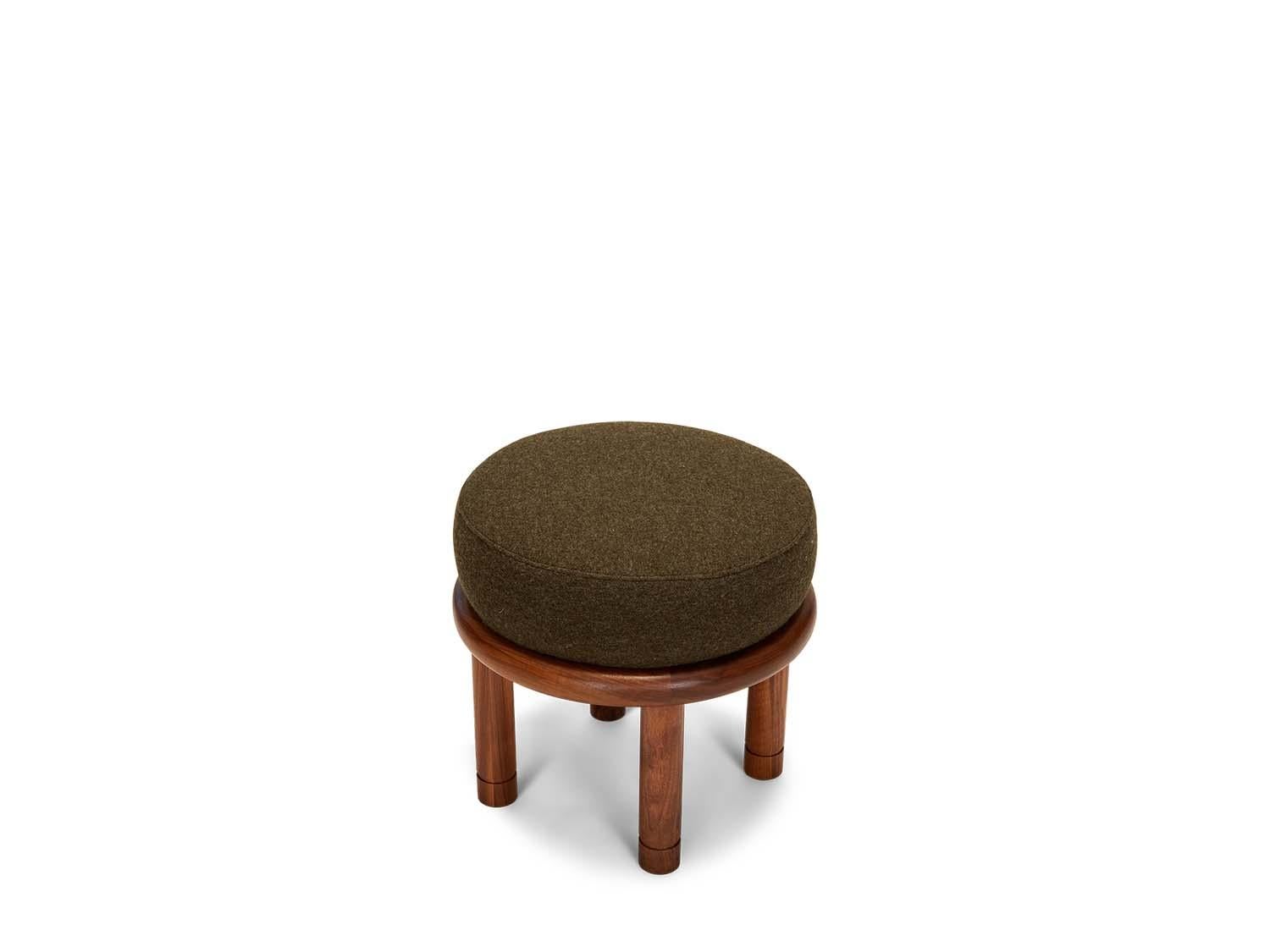 The Petite Moreno ottoman features a round solid wood base with four cylindrical legs and an upholstered top. Available in American walnut or white oak. 

 
 