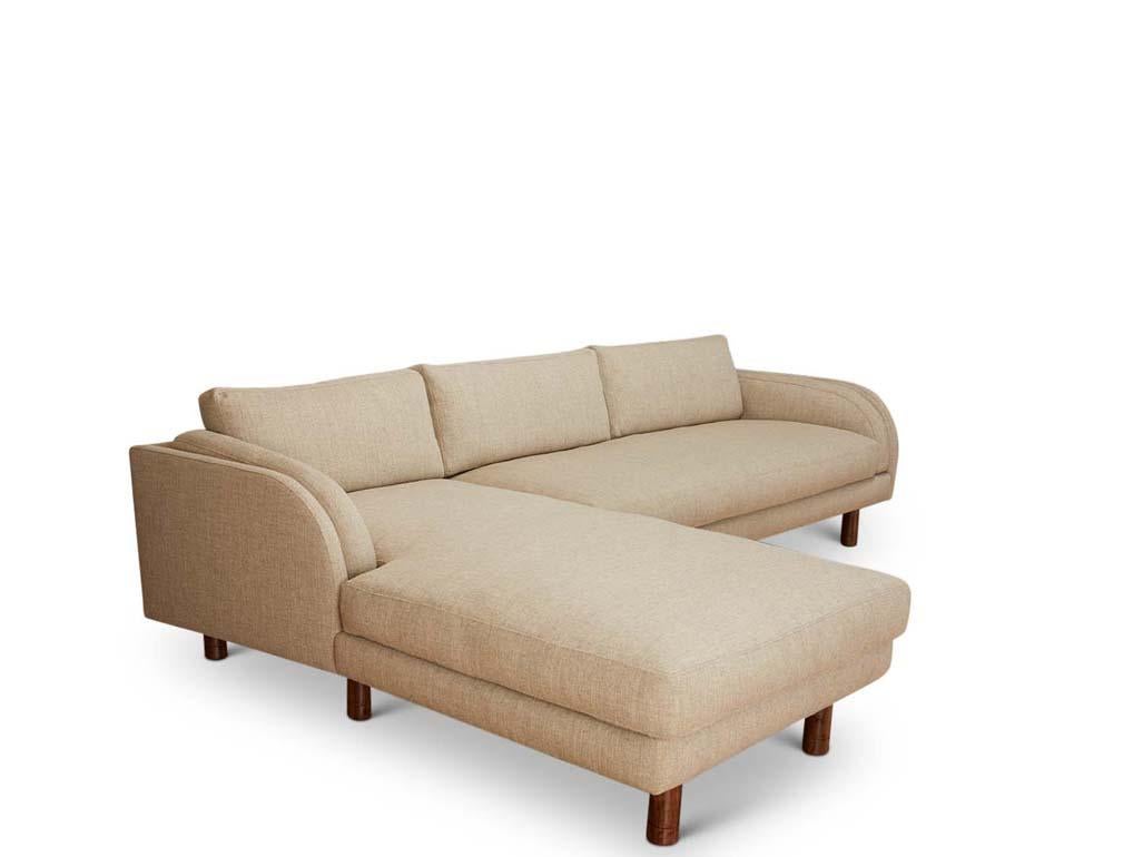 The 2 piece Moreno Sectional sits deep and spacious with a beautifully curved silhouette. This sectional consists of a bench sofa and a generous chaise which can be specified for either the left or the right side. The solid wood pole legs have an