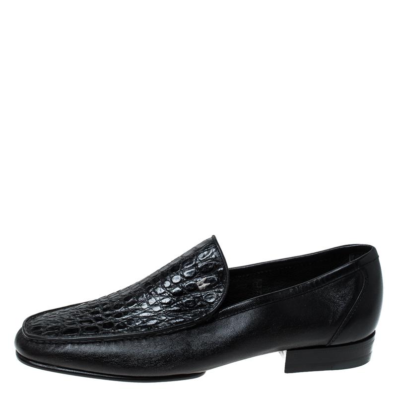 Moreschi is known for their sophisticated designs. Crafted from exotic croc leather and styled into a smart shape, this pair of black loafers embody a blend of luxury and comfort. Made in Italy, they feature comfy leather-lined insoles, silver-tone