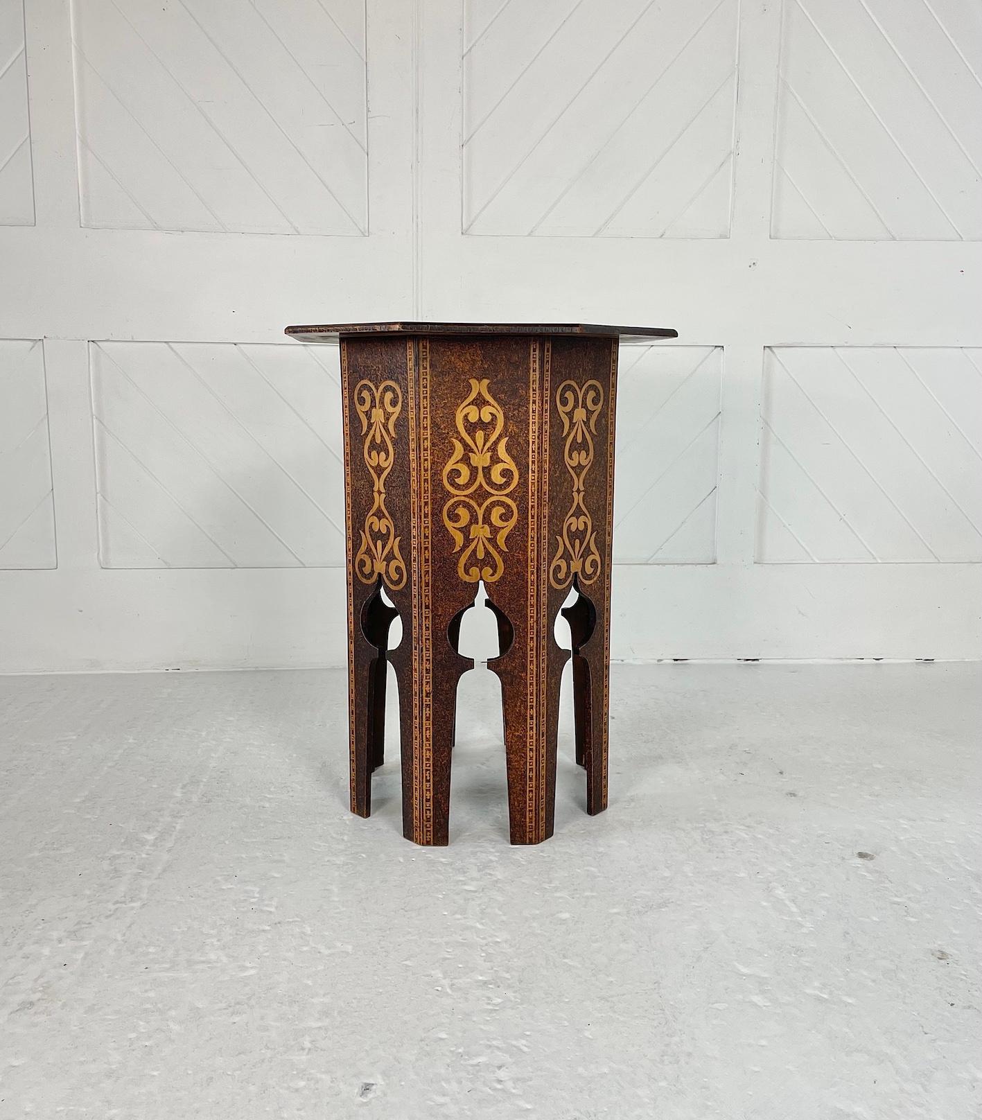 An Arts & Crafts poker work table designed in the Moresque style with cut out arched legs and decorative motifs to the top and side panel.
There is the remnants of a Scottish label underneath.
Circa 1900
Pokerwork is the art of decorating wood or