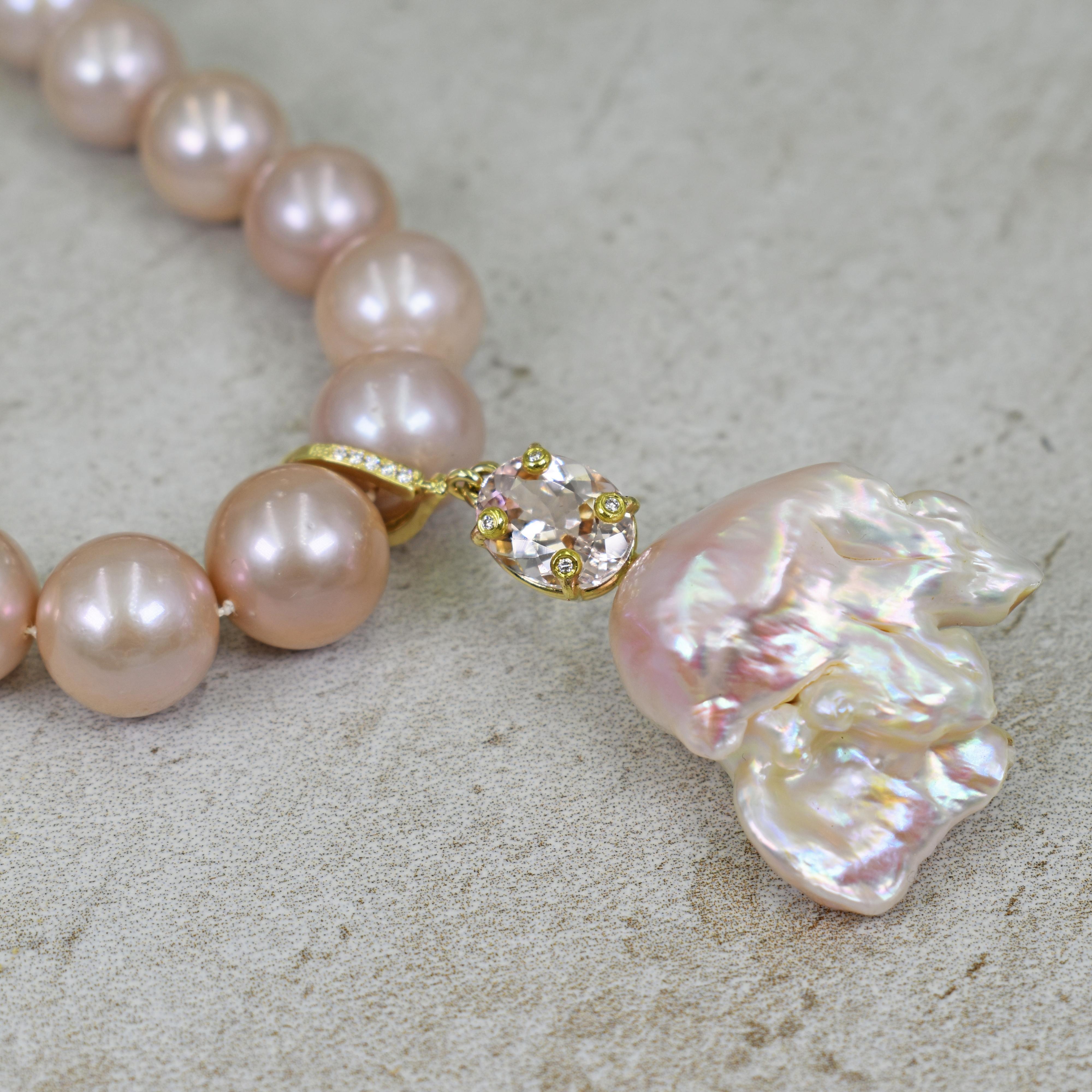 Gorgeous, large peachy pink Baroque Pearl, oval 5.04 carat Morganite and accent white diamond 14k yellow gold enhancer pendant on a graduated, round 12-15mm pink freshwater pearl beaded necklace. Necklace is finished with 14k gold chain and a swivel