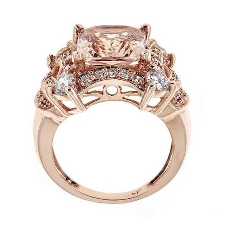 handmade 14k Rose Gold ring featuring a 6 carats princess cut Morganite stone accented with approximately 1.25 carats in round diamonds.