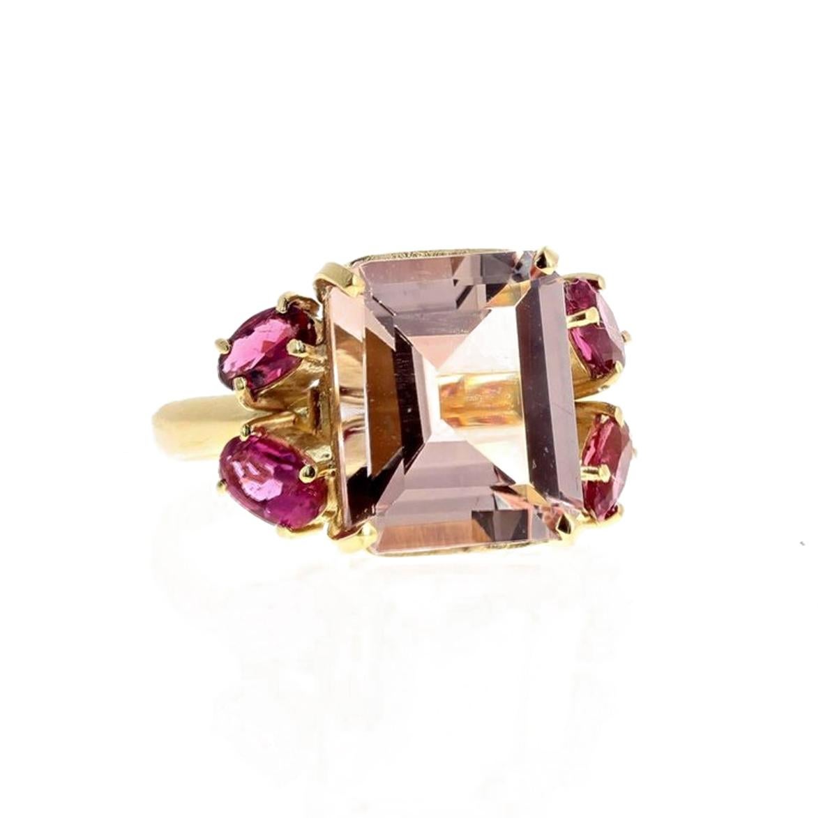 Gorgeous 4.5 carat sparkling natural pink Morganite (12.5 mm x 10.2 mm) enhanced with 4 brilliant deep pink Tourmalines (approximately 1.2 carats) set in this unique handmade 18 Kt yellow gold ring size 5 3/4 (sizable FOR FREE).  There are no eye