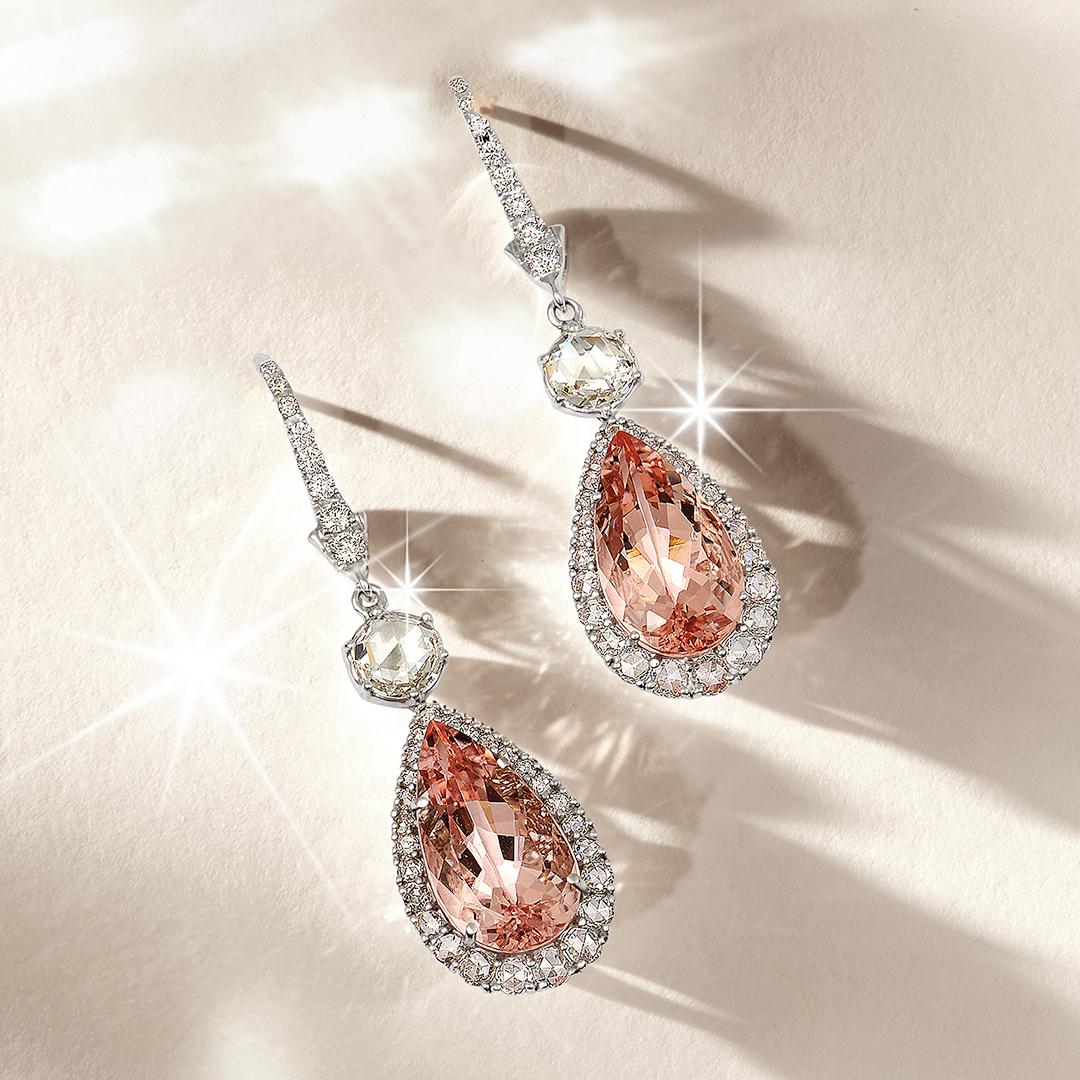 These 18ct Morganite and Rose Cut Diamond Drop Earrings are set with 2 pear shaped Morganites totalling 10.5ct and set with 142 diamonds totalling 3.28ct. 