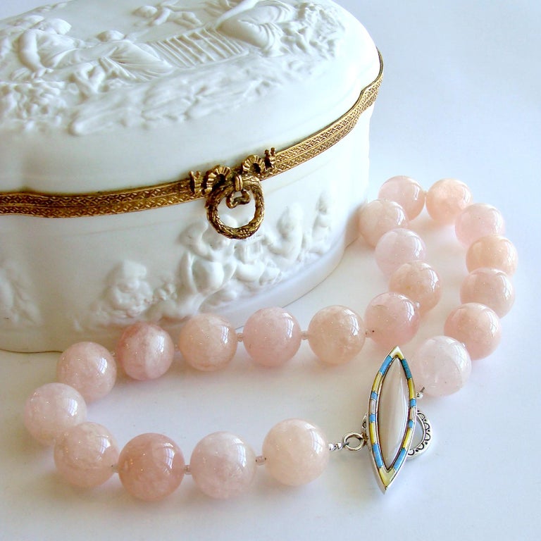 Varying shades of ballet pink and pink grapefruit colored luxe morganite beryl beads are gently separated, creating a bountiful statement choker necklace designed to celebrate spring and summer colors.  The blush pink Peruvian opal inlay toggle with