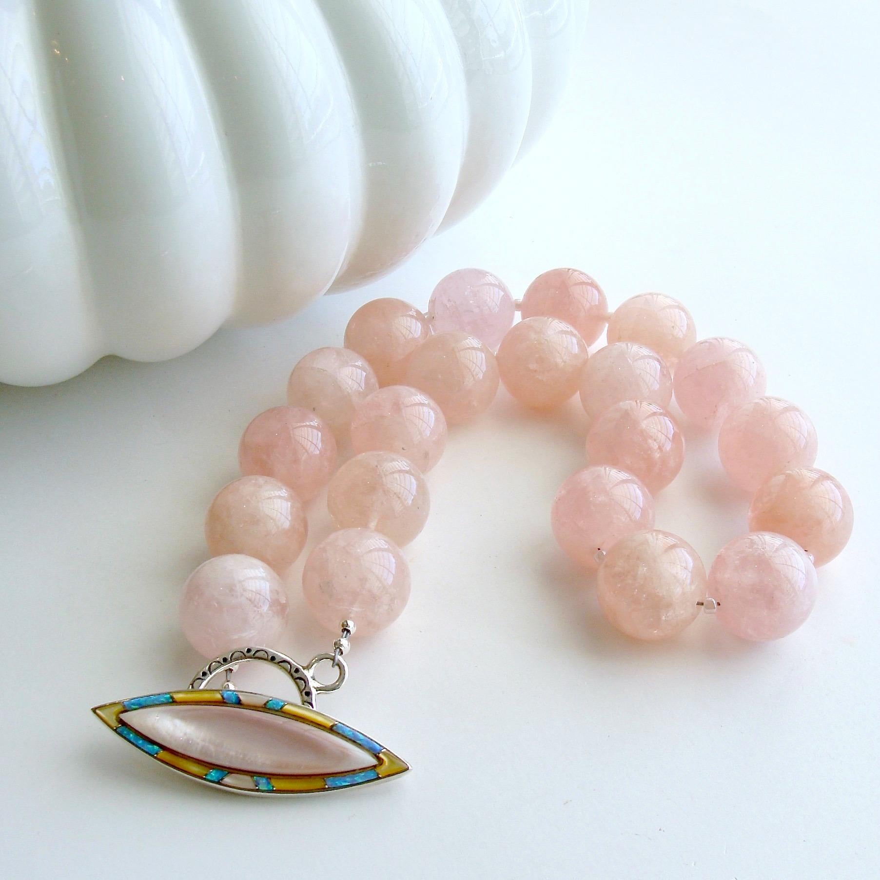 Varying shades of blush pink and pink grapefruit colored luxe morganite beryl beads are gently separated, creating a bountiful statement choker necklace designed to celebrate spring and summer colors.  The blush pink Peruvian inlay opal toggle can
