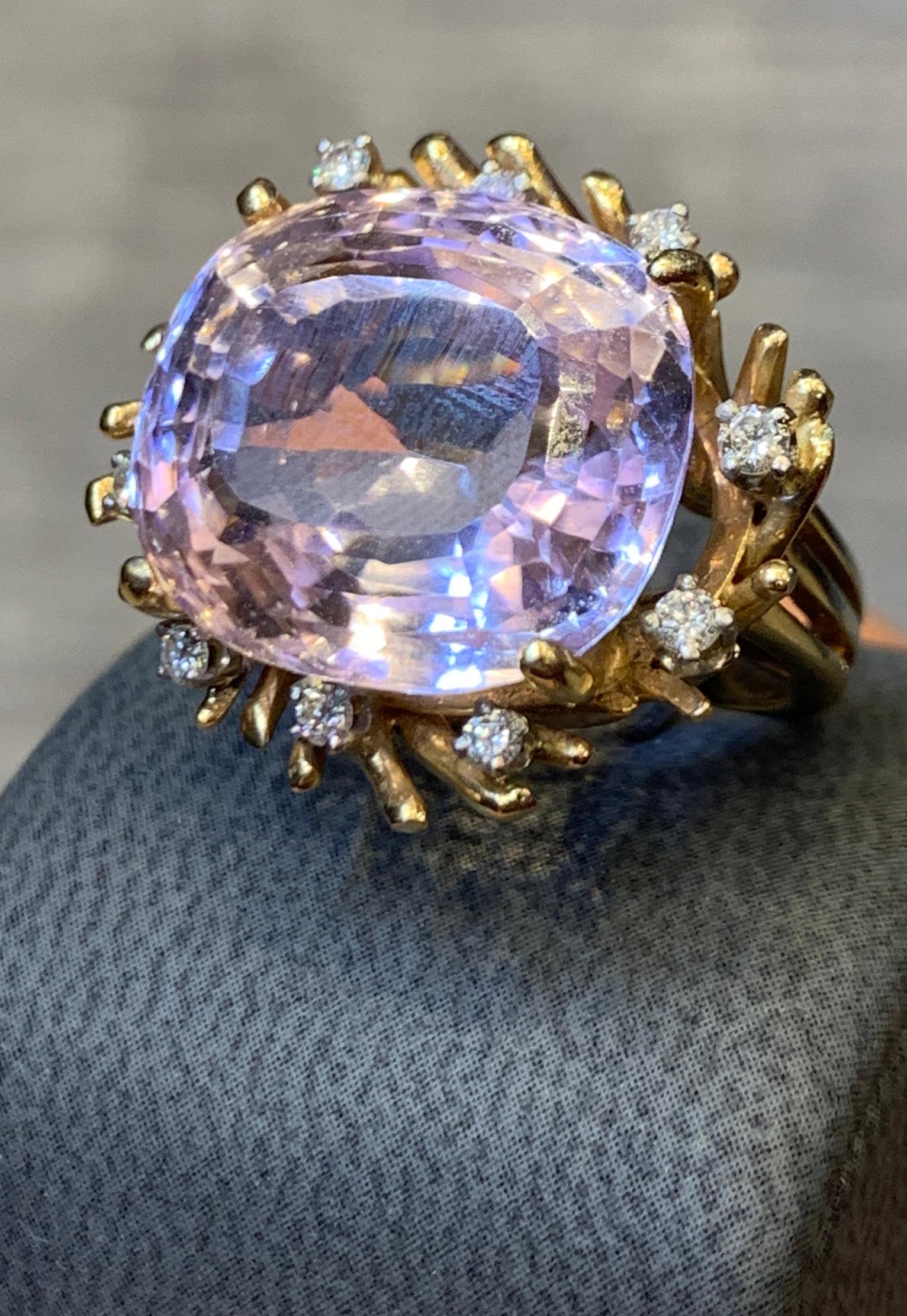 Morganite & Diamond Cocktail Ring, 1 cushion cut morganite surrounded by 10 round cut diamonds all set in a split shank 14k yellow gold setting

Ring Size: 5.5 

Re sizable free of charge
