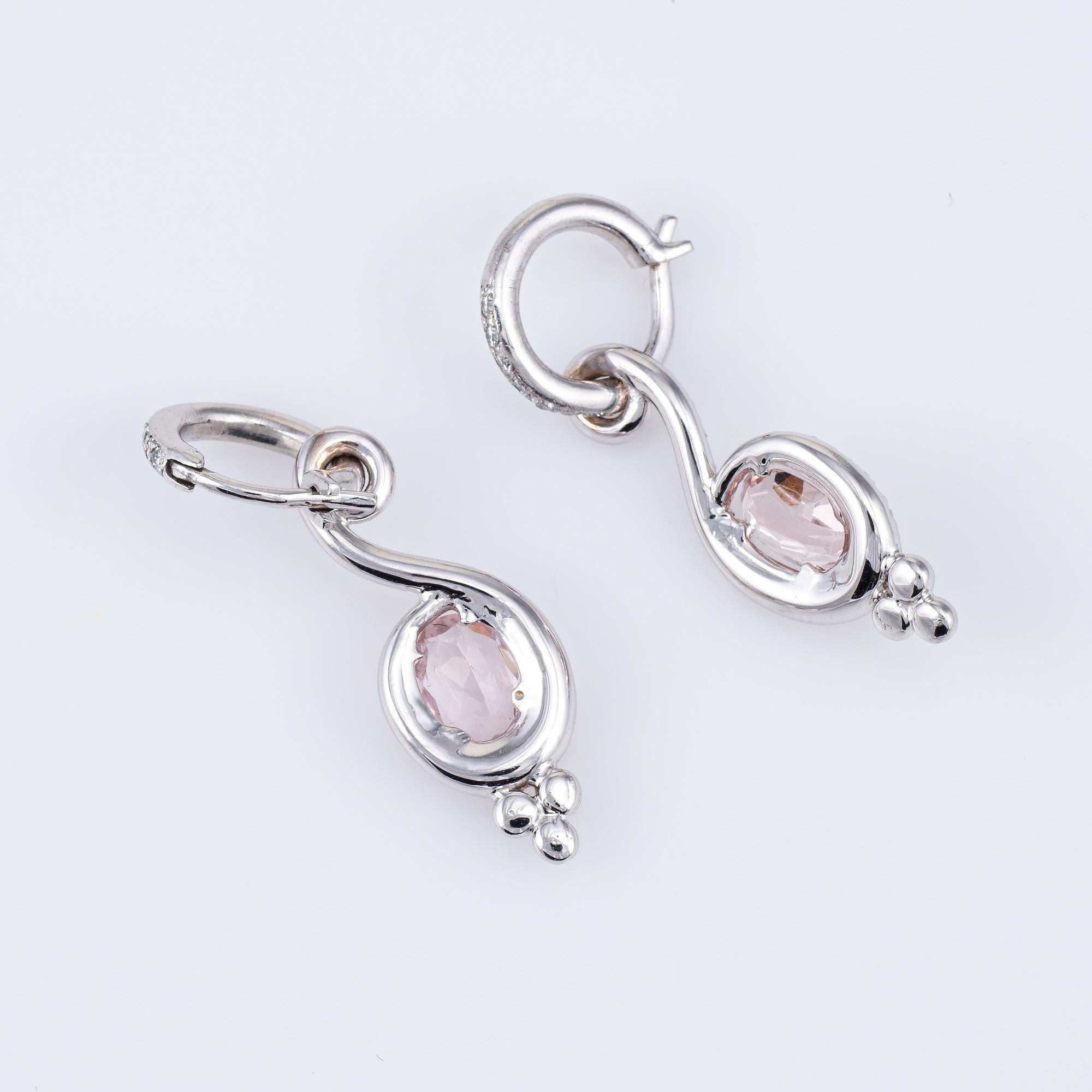 Elegant pair of morganite & diamond drop earrings, crafted in 18k white gold. 

Oval faceted Morganite is estimated at 1 carat each (2 carats total estimated weight). The diamonds total an estimated 0.38 carats (estimated at H-I color and SI1-2