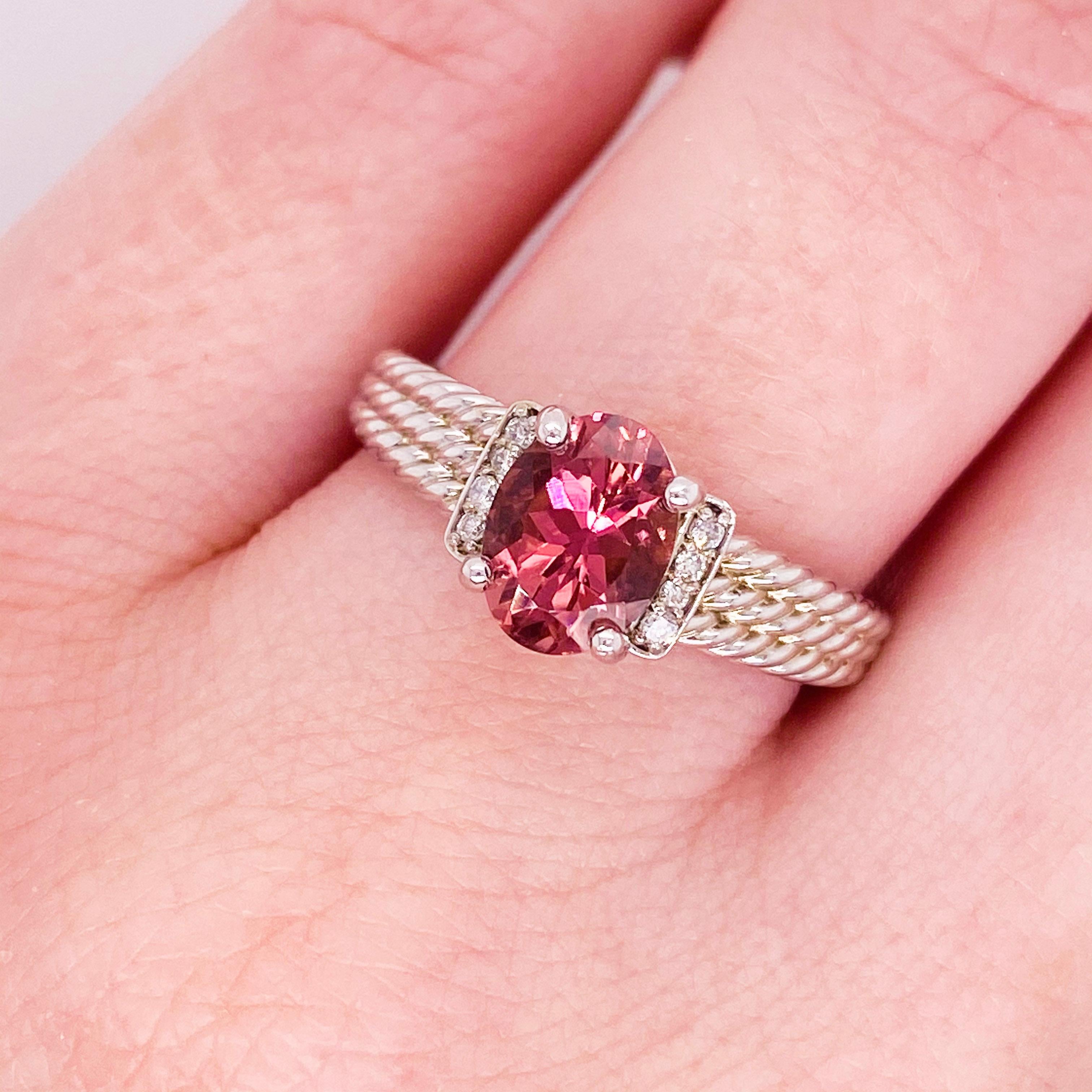 The custom morganite ring in 14k white gold is a stunning piece with a genuine morganite gemstone set on a triple twisted band. The morganite is oval cut with a beautiful polish that sparkles brilliantly. The morganite is accented by two rows of
