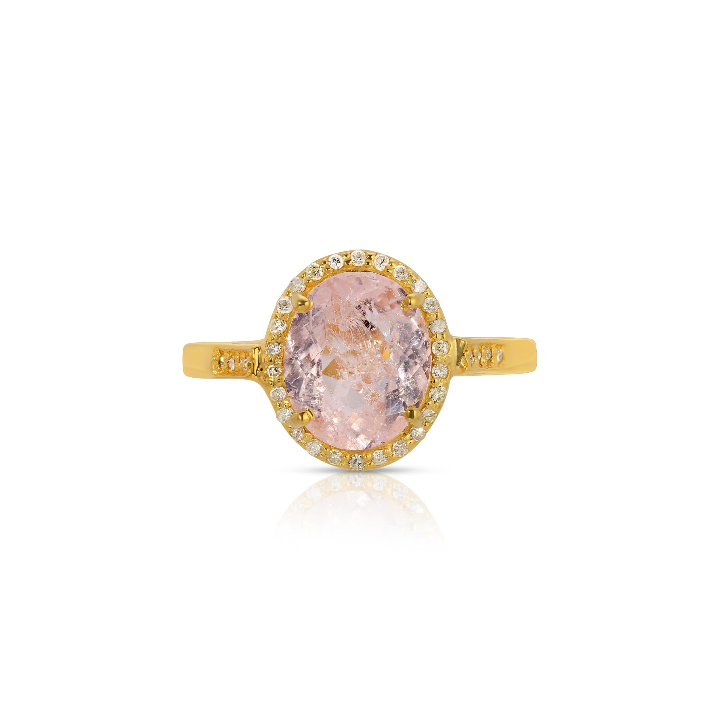 A timeless cocktail ring of contemporary design featuring a mix of gemstones. This ring features a luminous 2.26 Carat pink Morganite in a bezel setting of White Diamonds on a gold band also set with Diamonds. This ring has a total Diamond weight of