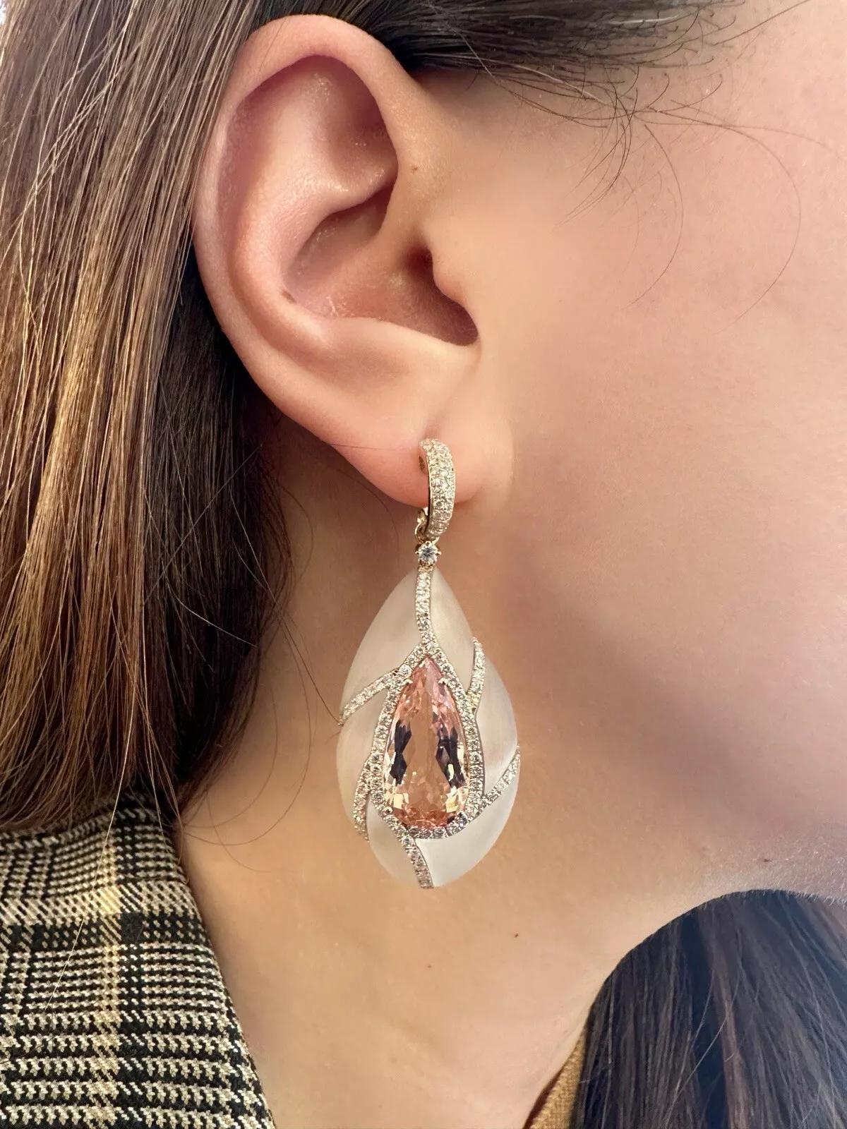 Morganite, Diamond & Rock Crystal Drop Earrings in 18k Rose Gold 

Rock Crystal and Morganite Earrings feature Pear shaped Morganites set in the center of Rock Crystal Pear shaped with ribbons of Round Brilliant Diamonds set in 18k Rose Gold. The
