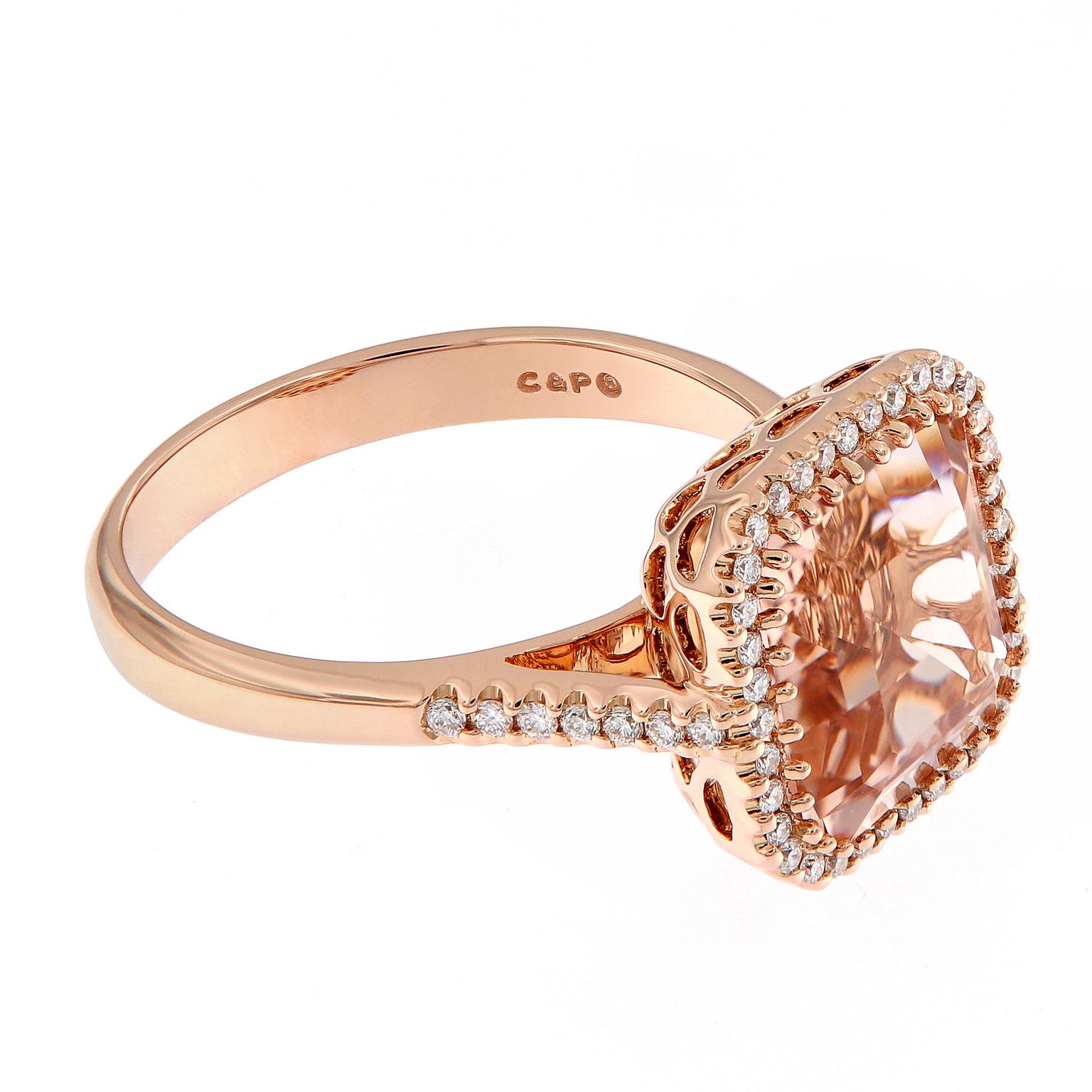 Beautiful 18k rose gold cocktail ring centers around a 3.79 carat morganite, surrounded with a halo of diamonds and beautifully balanced with diamonds running down the shank. Ring Size 7. 

Morganite 3.79 ct
Diamonds 0.26 cttw
