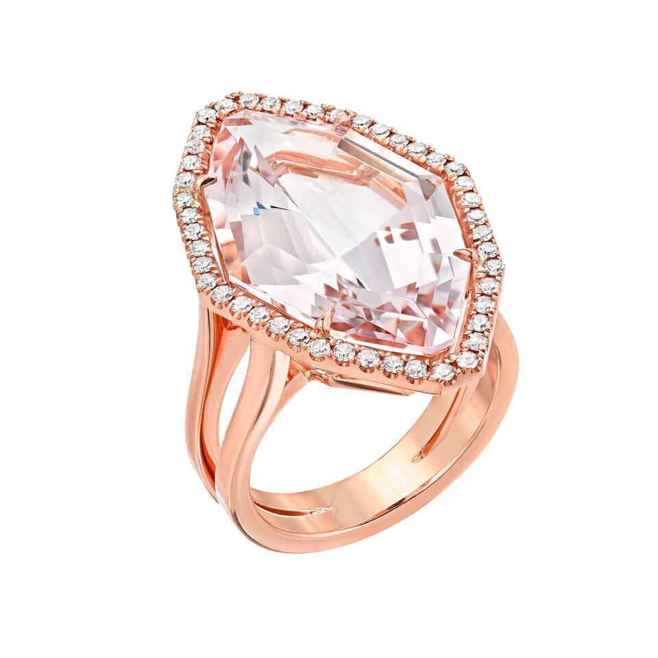 10.69 carat Morganite, showcasing a pristine and unique fancy cut, is surrounded by 0.15 carats total of round diamonds, to comprise this magnificent 18K rose gold ring.
Size 6. Resizing is complementary upon request.
Returns are accepted and paid