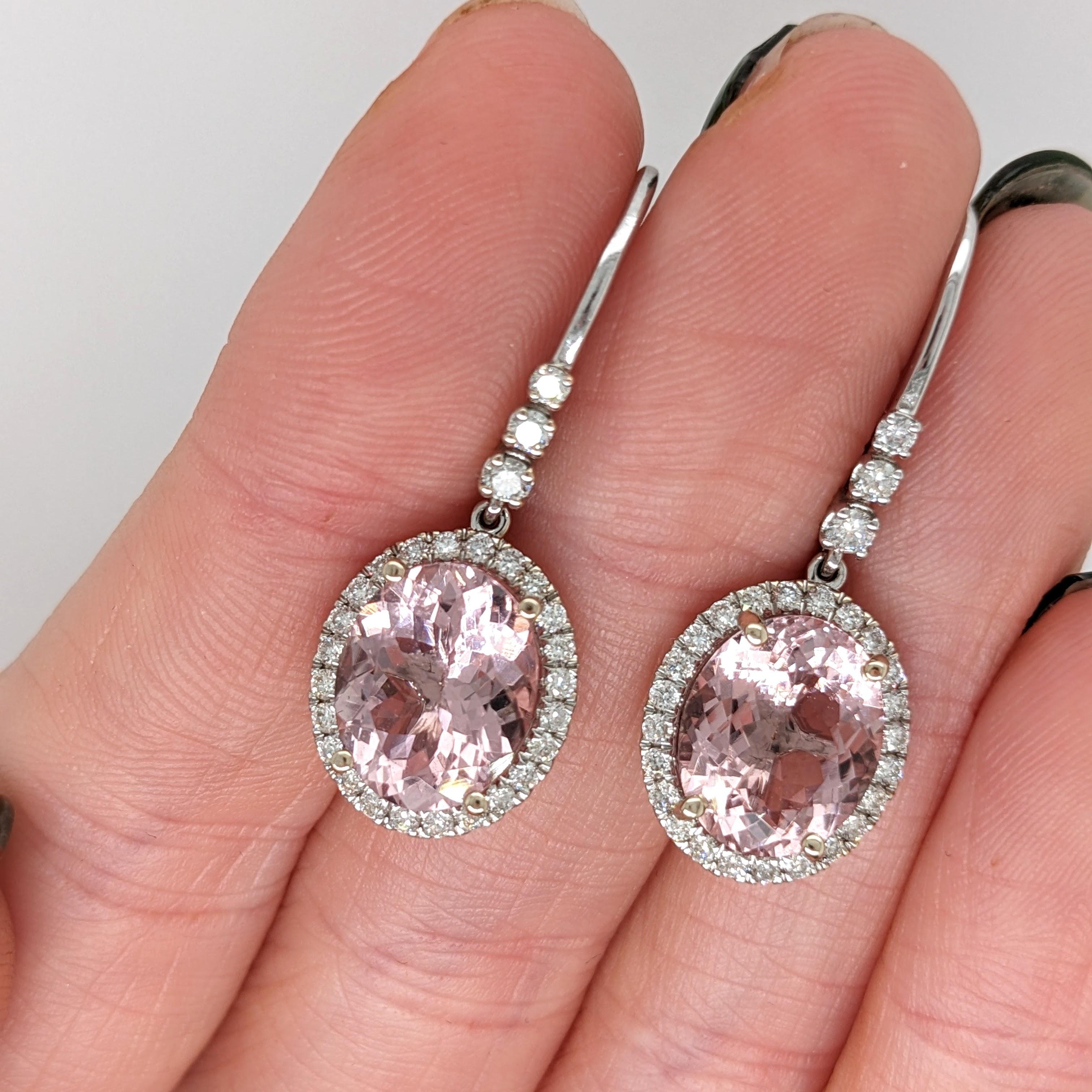 These beautiful drop earrings features two 6.13 cttw morganite oval gemstones with natural earth mined diamonds all set in solid 14k gold. 

Specifications

Item Type: Earrings
Center Stone: Morganite
Treatment: Heated
Weight: 2/6.13 cttw
Head